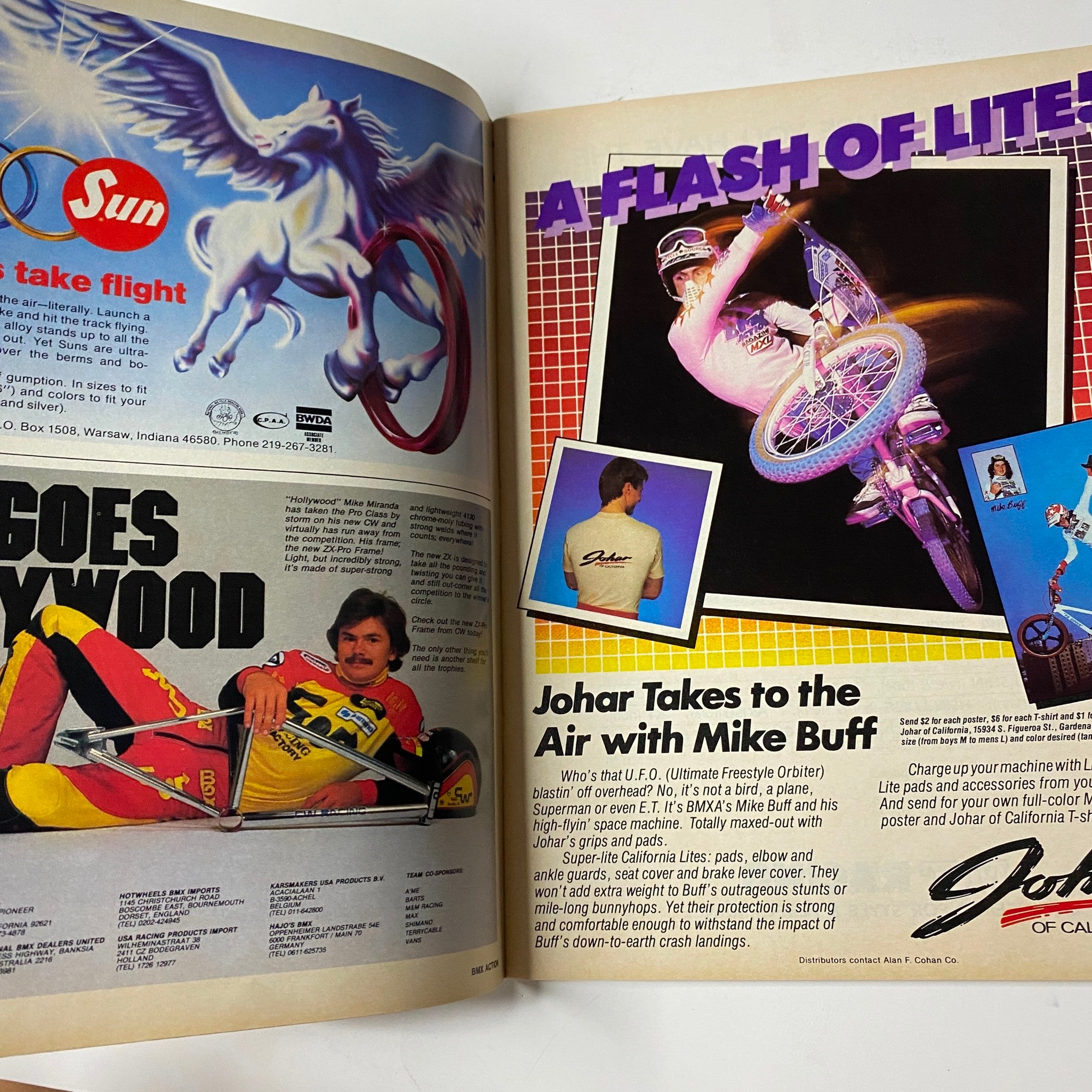 Advertisement page from BMX Action Magazine May 1983 Vol 8 No. 5 promoting bike parts and gear, featuring a colorful design and BMX rider Mike Buff.