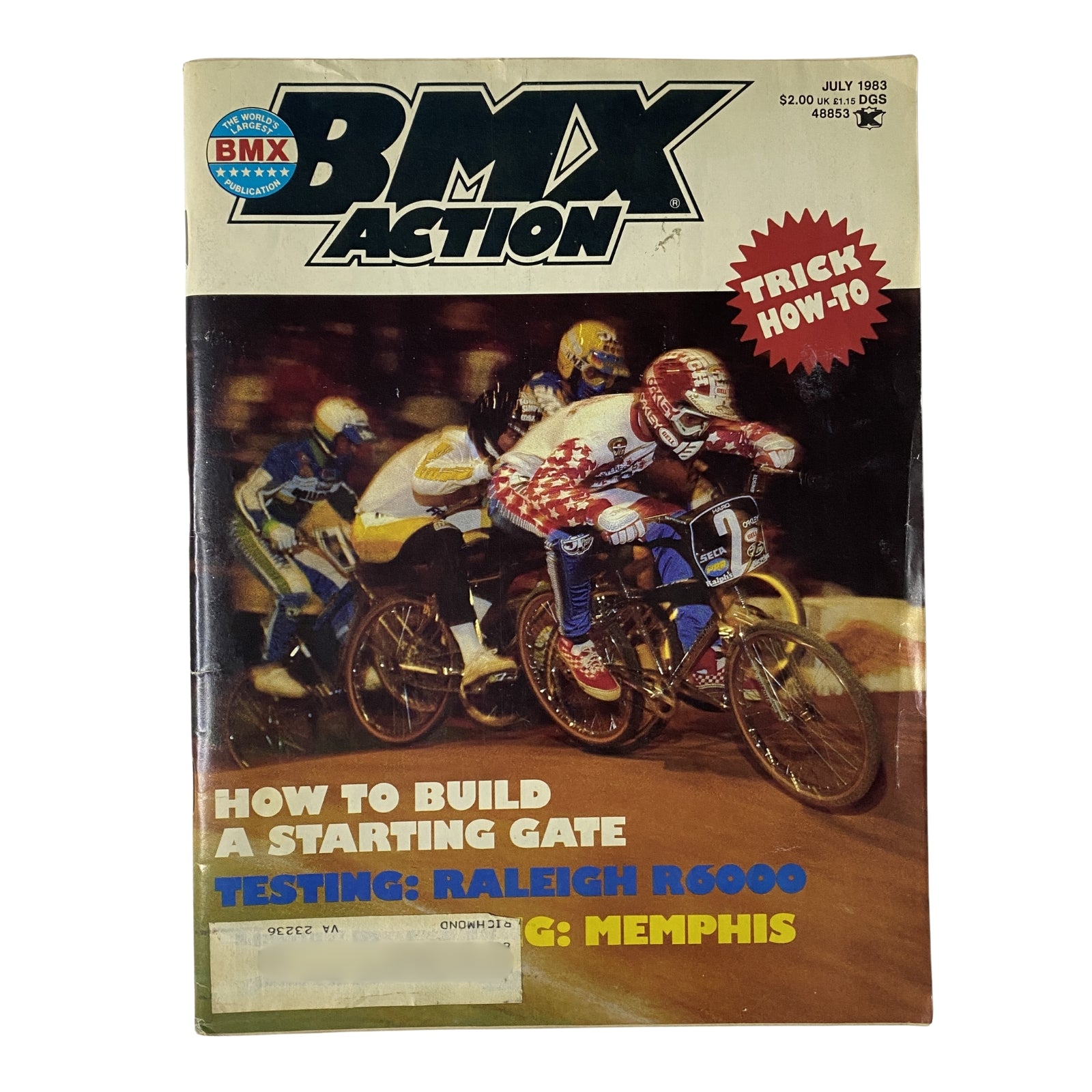 BMX Action Magazine July 1983 Vol 8 No. 7 cover featuring Toby Henderson racing in Memphis with details about how to build a starting gate and testing the Raleigh R6000.