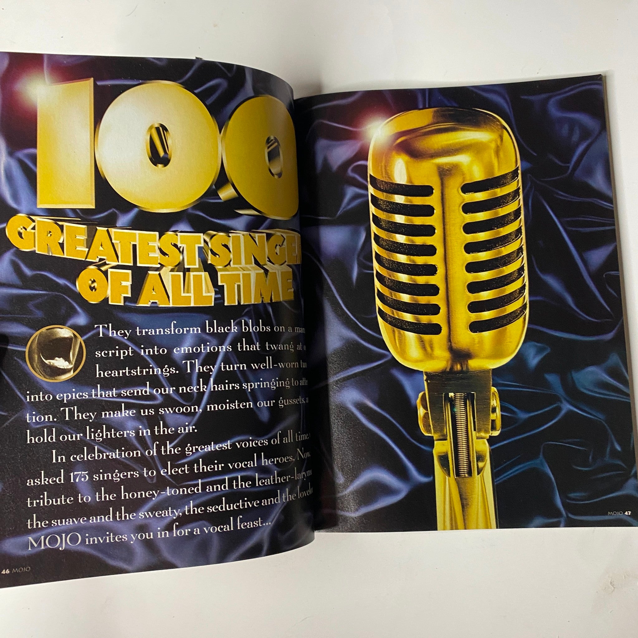 Inside page of Mojo Music Magazine, October 1998, showcasing the section '100 Greatest Singers of All Time' with a golden microphone on a blue silk background.