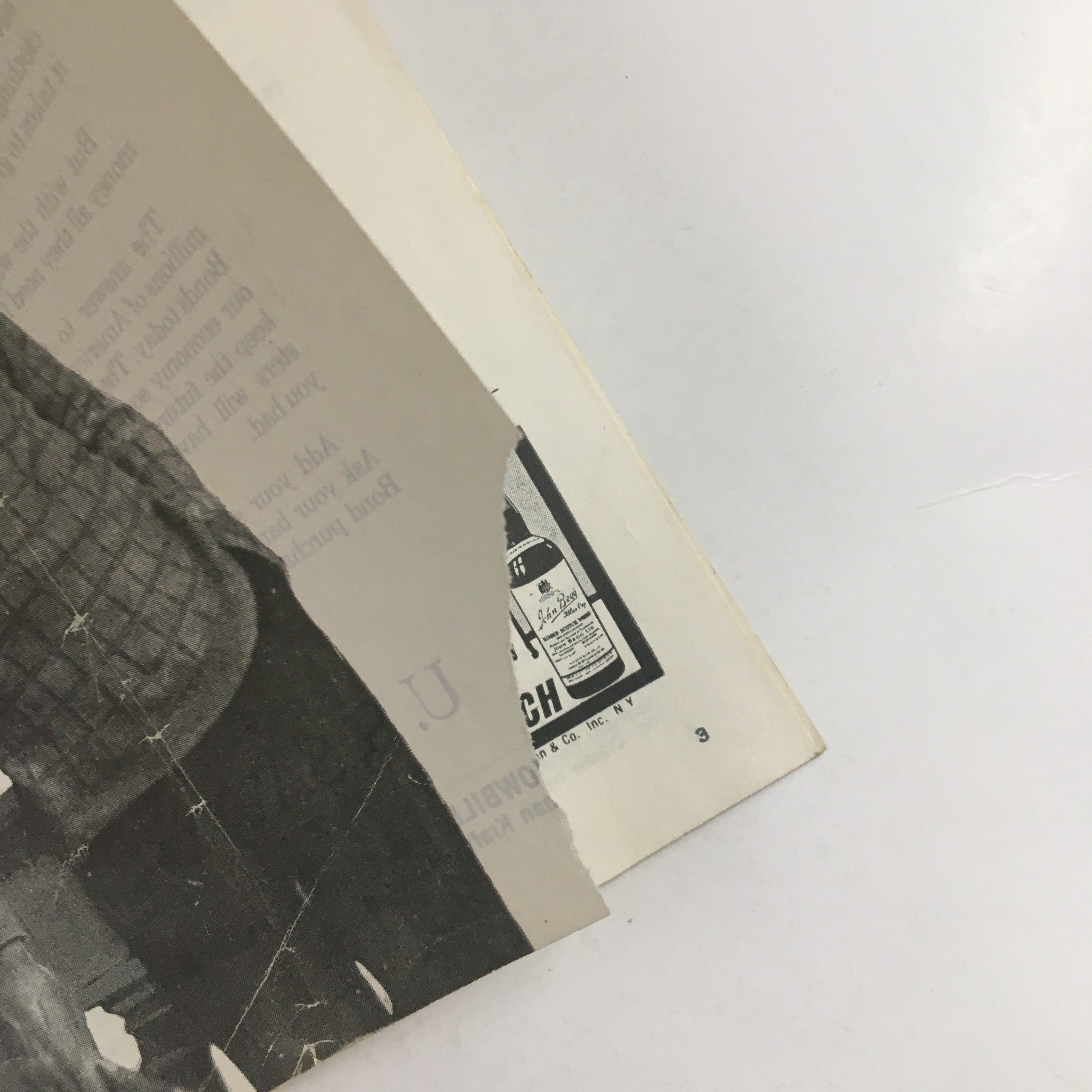 Close-up view of the edge of the 1958 Showbill for Eugene O'Neill's Desire Under The Elms, showing wear and tear with a torn corner.