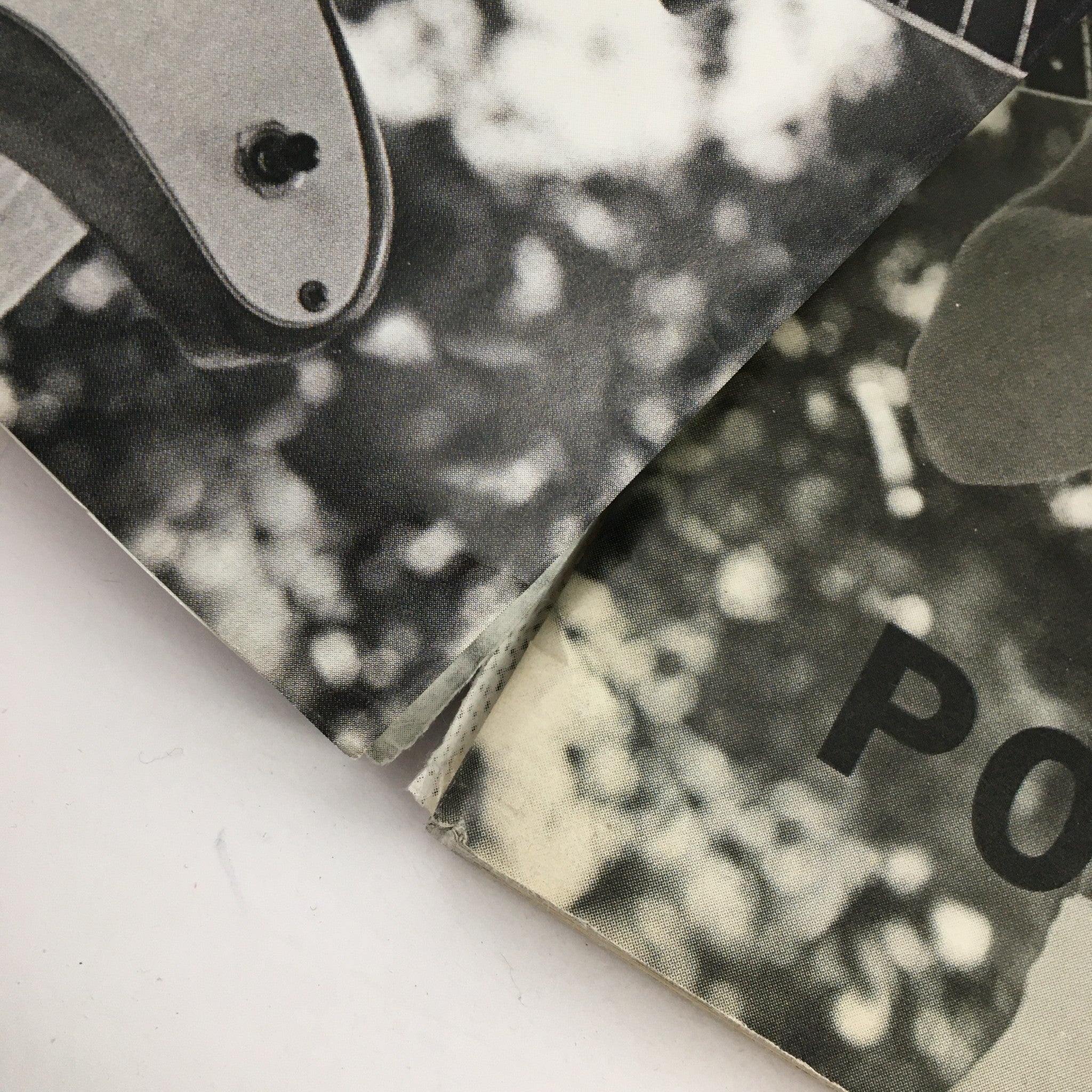Detail of the spine and corner of the Rolling Stone Magazine April 15 1999, featuring black and white photography and showing slight wear indicative of its vintage status.