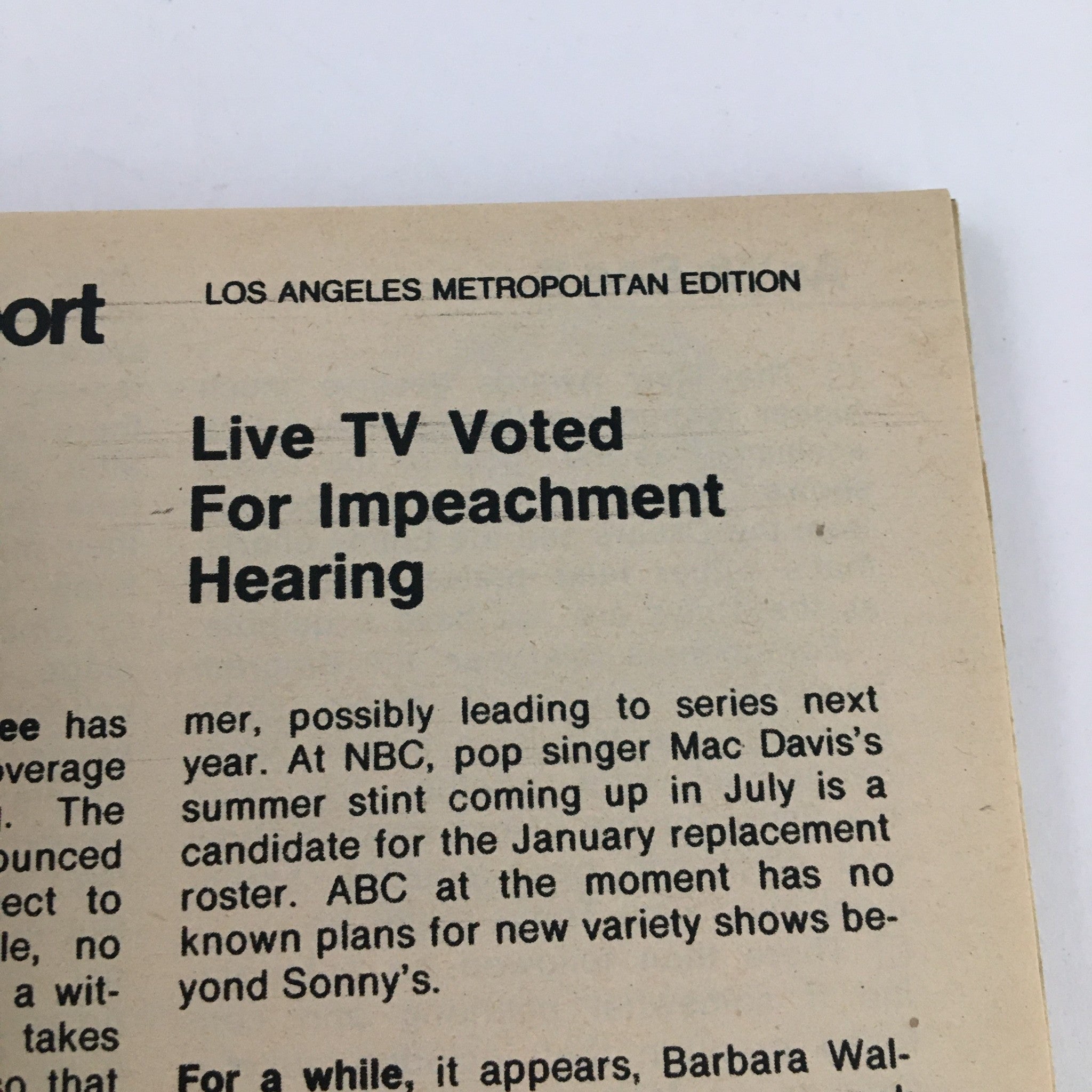 Close-up view of a TV Guide Magazine article titled 'Live TV Voted For Impeachment Hearing' from the May 11, 1974 issue featuring Bob Newhart and Peter Bonerz. The text highlights the impact of live television during a significant political event, reflecting the television landscape of the 1970s.