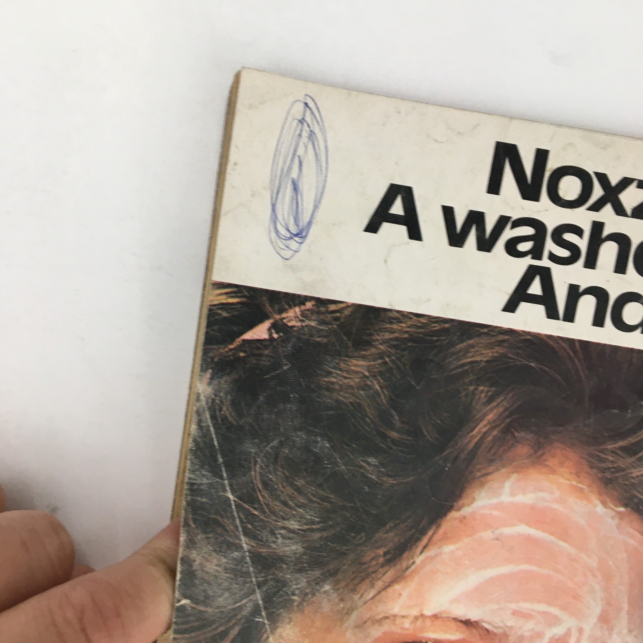 Close-up of a Noxzema advertisement in Tiger Beat Magazine February 1976, showcasing a model with a facial treatment.