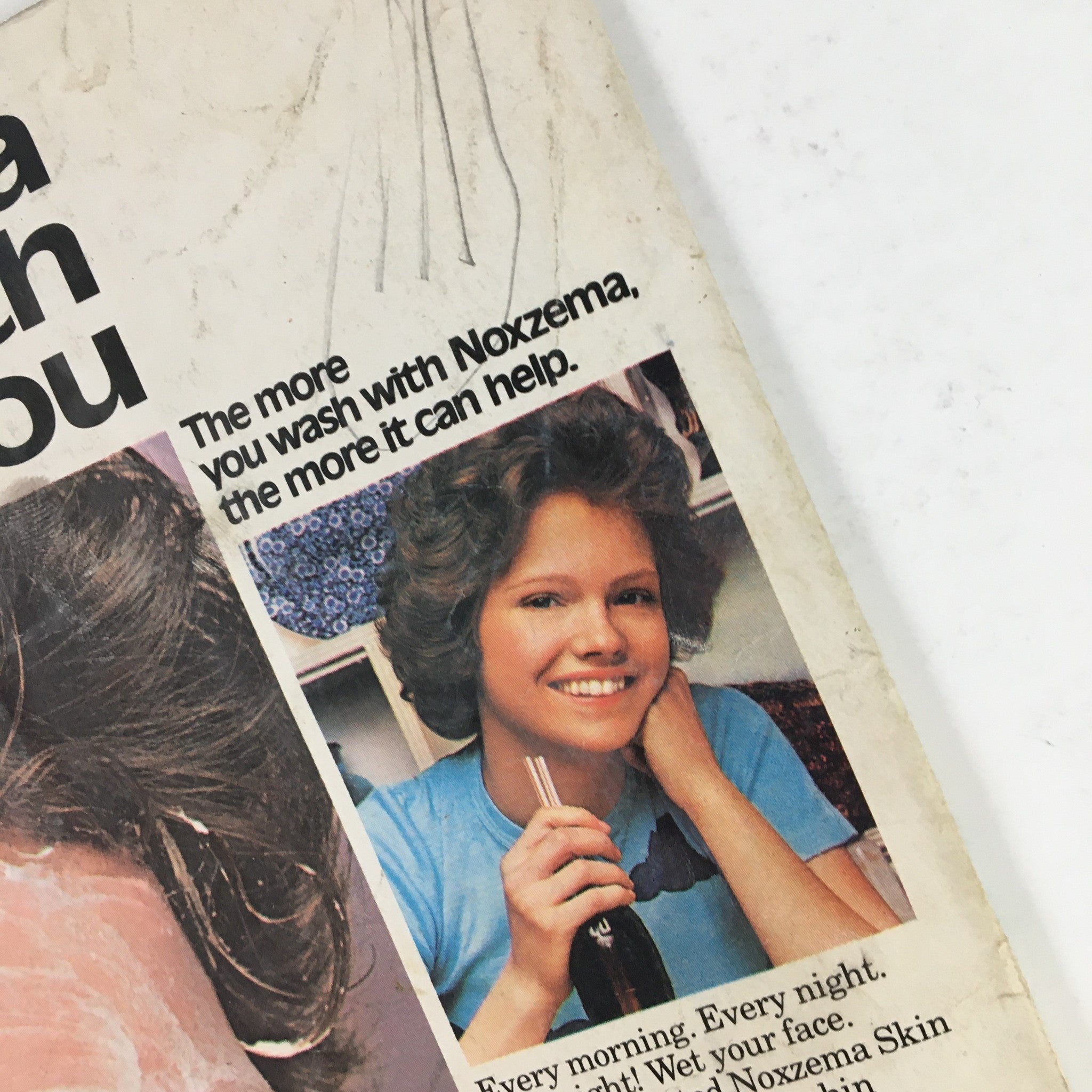 Detail of a Noxzema advertisement from Tiger Beat Magazine February 1976, highlighting the skincare benefits and featuring a smiling model.
