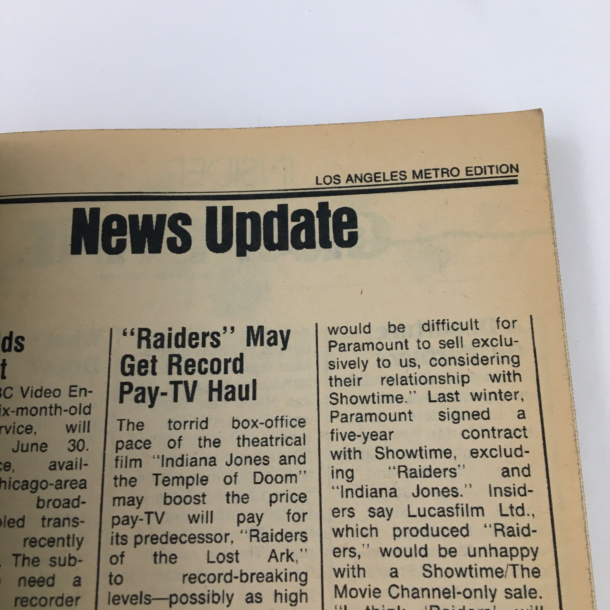 Inside page from TV Guide Magazine dated June 23, 1984, featuring news update section regarding 'Raiders' and pay-TV deals.