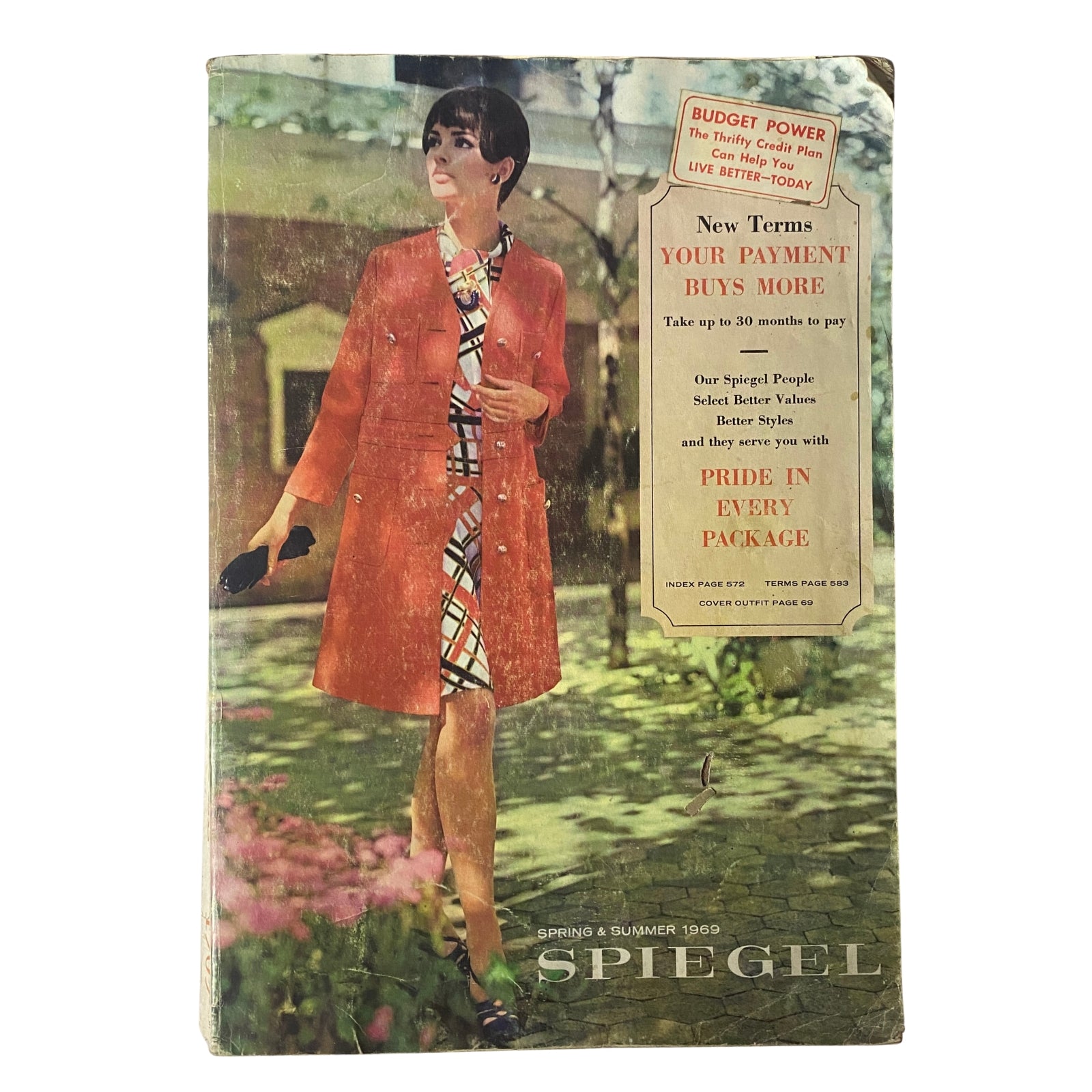 Cover of the 1969 Spiegel Spring and Summer Catalog showcasing a fashionable woman in a vibrant outfit, embodying the style of the era, with text advertising budget power and payment options.