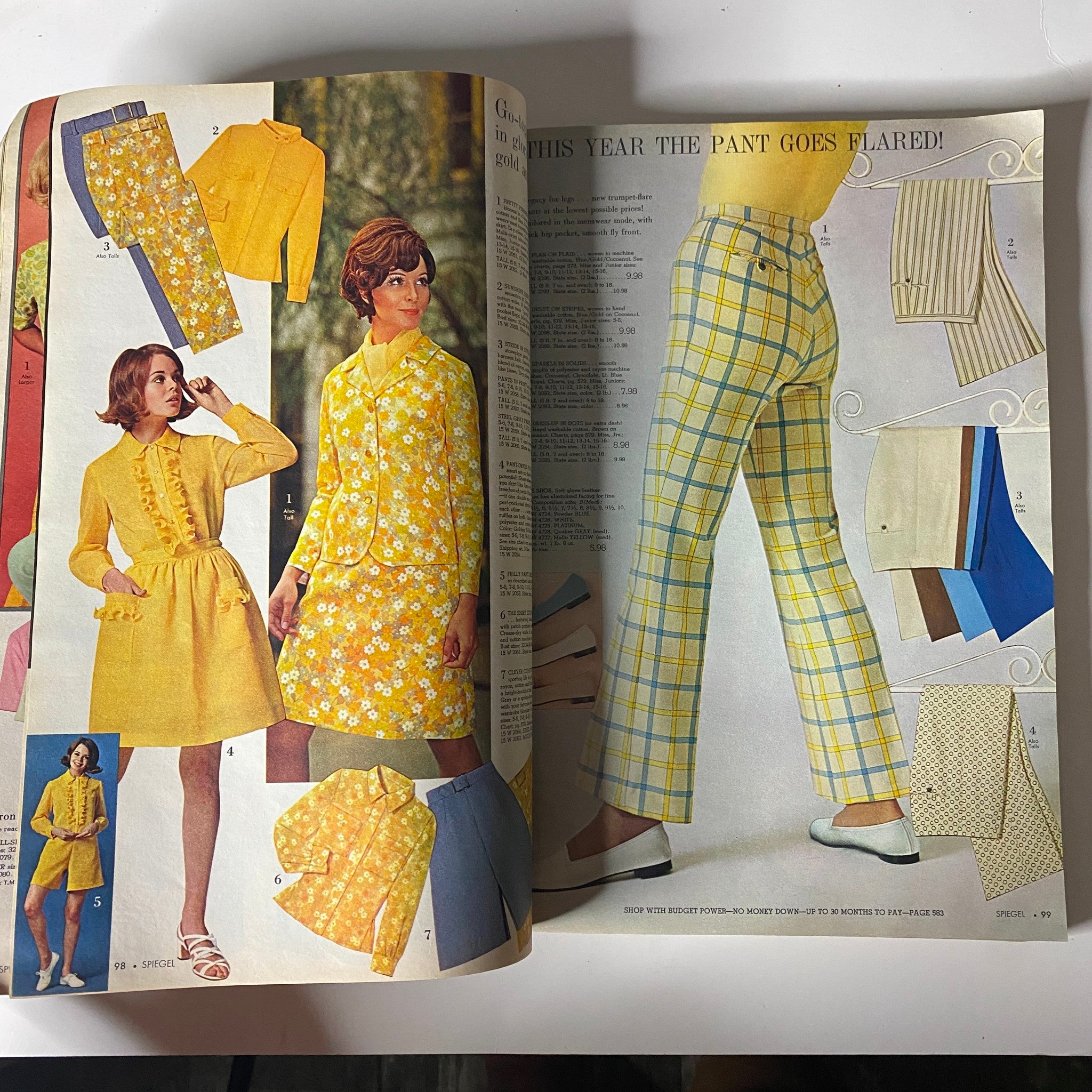 Inside pages of the 1969 Spiegel Spring and Summer Catalog presenting vibrant yellow flared pant outfits, emphasizing 1960s fashion trends.