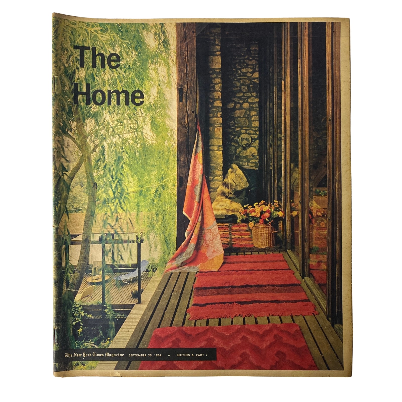 Cover of The New York Times Magazine dated September 30, 1962, titled 'The Home,' featuring a serene porch view adorned with a red rug and natural surroundings.