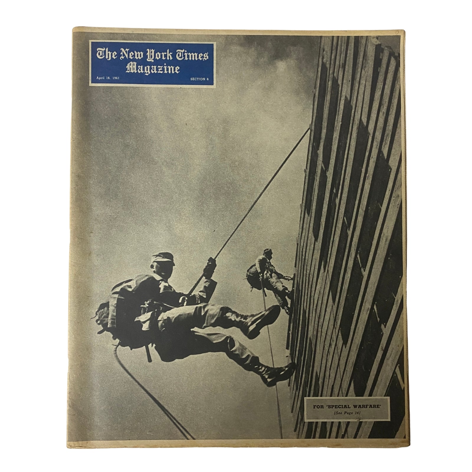 The New York Times Magazine April 16, 1961 cover featuring 'Special Warfare' theme, showcasing a soldier rappelling down a building.