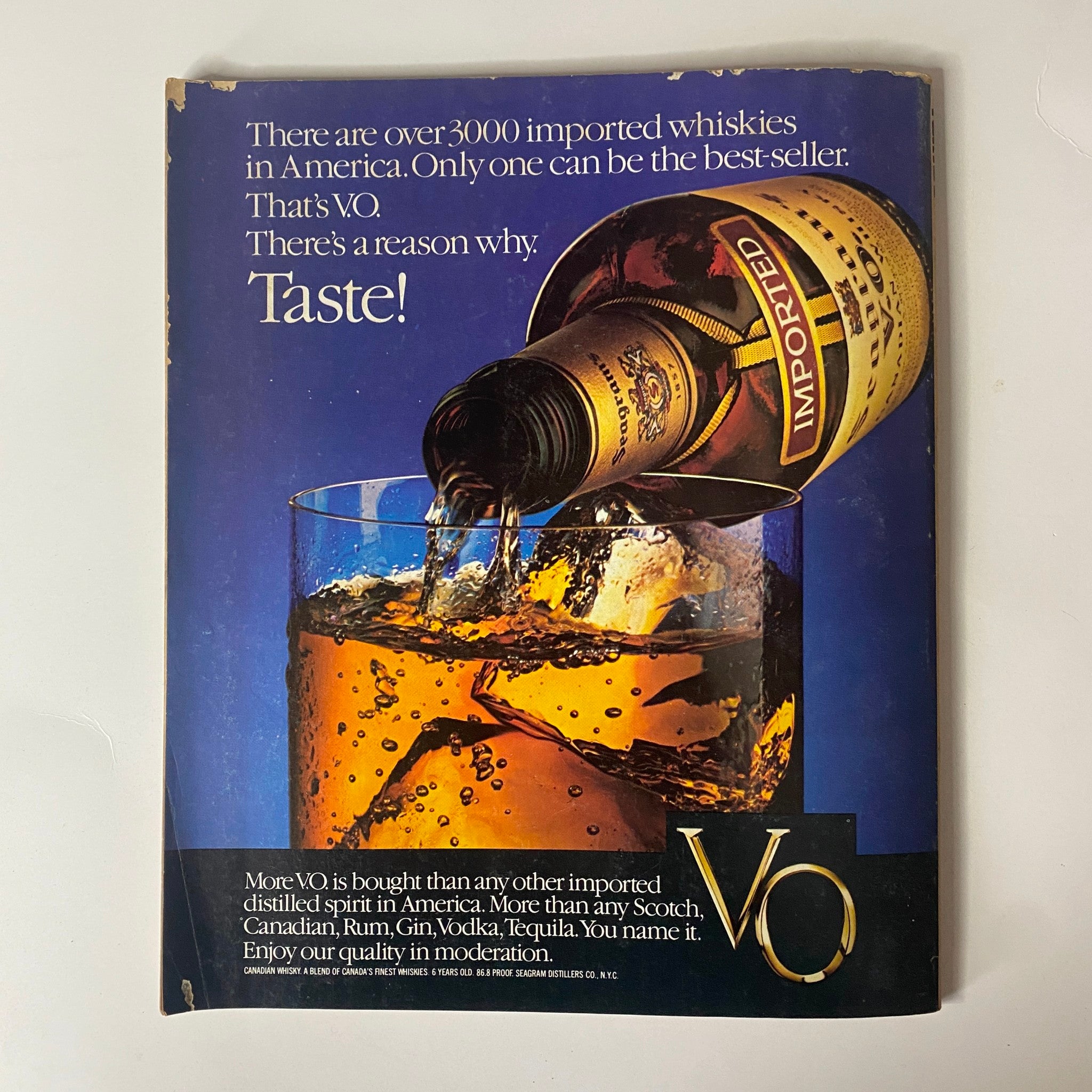 Advertisement for VO whiskey from Fortune Magazine, showcasing a bottle pouring into a glass with the tagline highlighting its distinction as the best-selling imported whiskey in America.
