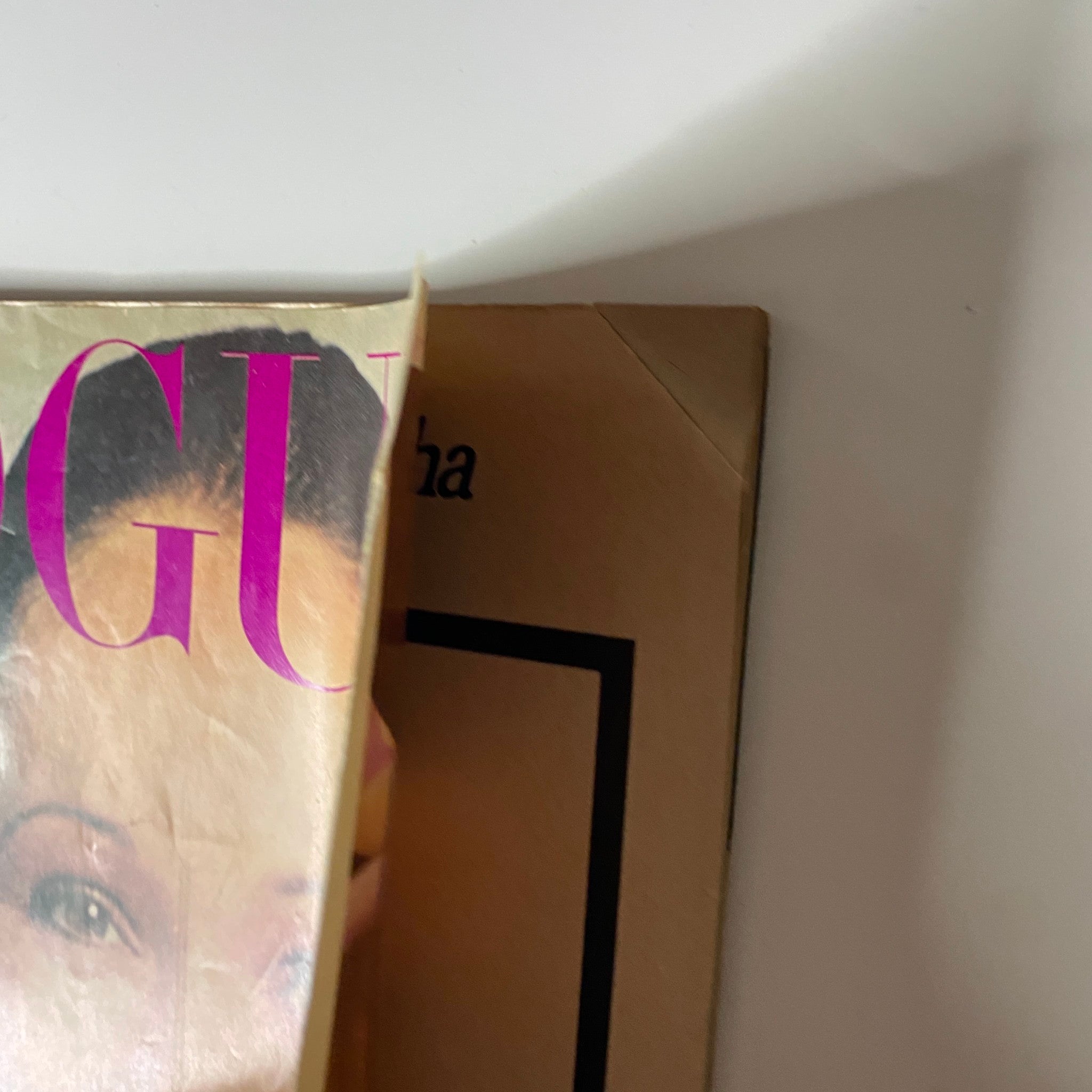 Partial view of Vogue Magazine January 15, 1972 Lynn Woodruff Cover, focusing on the magazine title and slight corner damage.