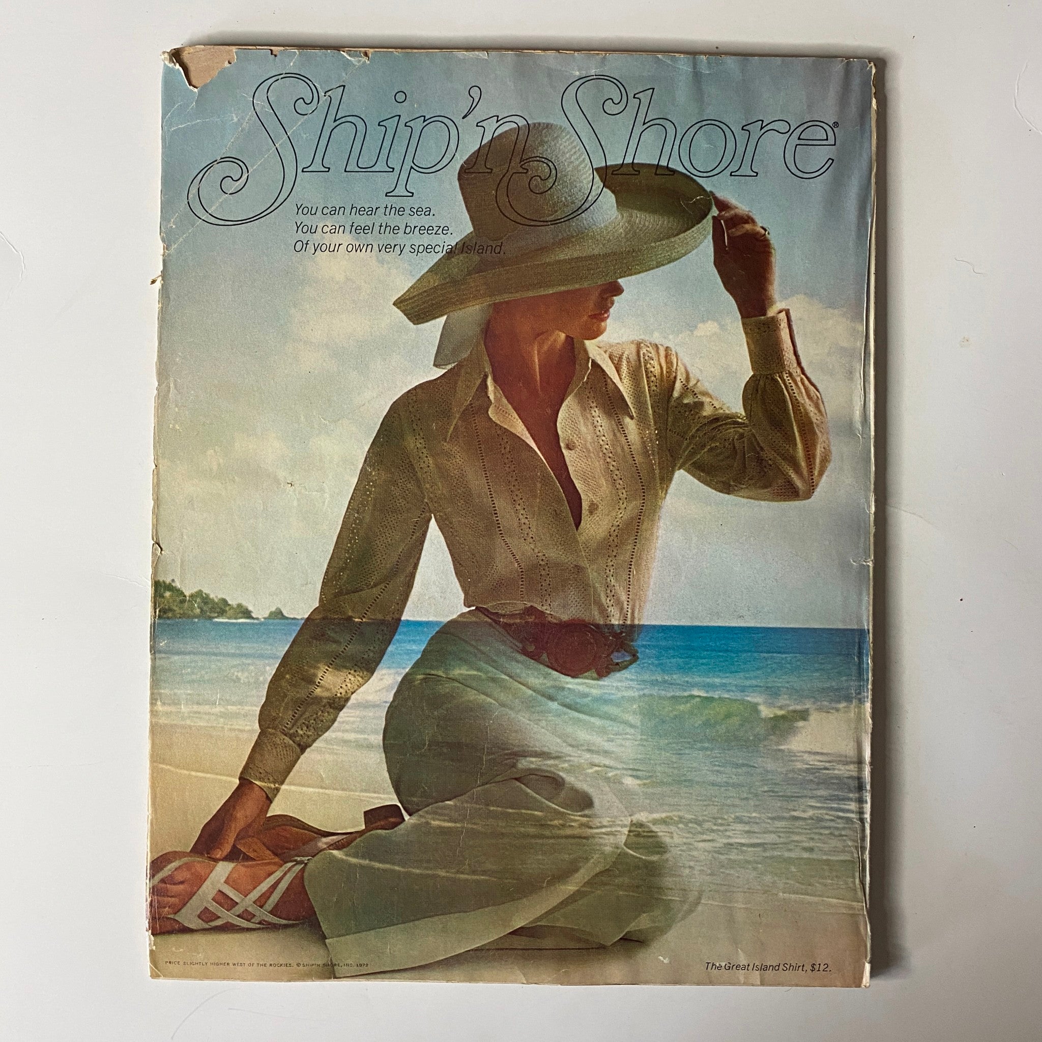 Vogue Magazine January 1, 1972 Lauren Hutton Cover GD Interior presenting a serene seaside scene, showcasing a model in a stylish blouse and hat, evoking a relaxed coastal aesthetic.