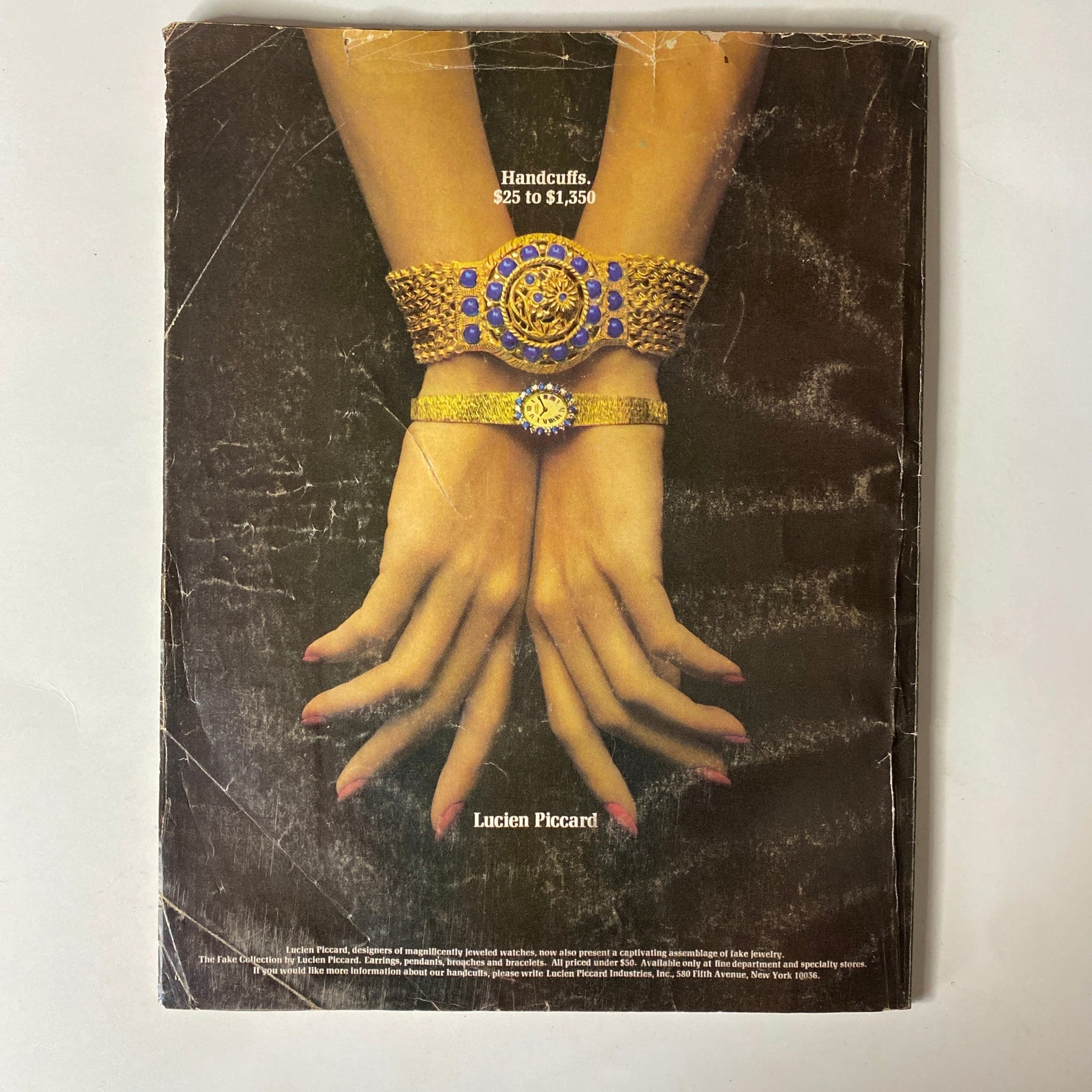 Vogue Magazine November 15, 1971: An artistic image showcasing hands adorned with intricate gold handcuff-style bracelets, highlighting the exquisite jewelry featured in the magazine and enhancing the luxurious fashion narrative.
