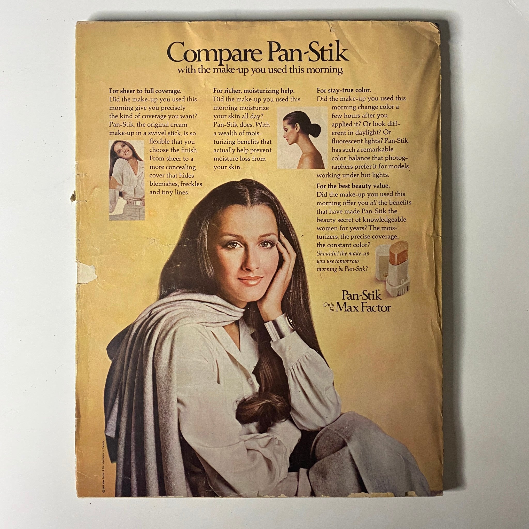 Vintage advertisement for Pan-Stik makeup featuring a model promoting Max Factor's product, emphasizing its smooth application and coverage. The ad is from the May 1971 issue of Vogue Magazine featuring Lauren Hutton on the cover, showcasing early 70s beauty standards.