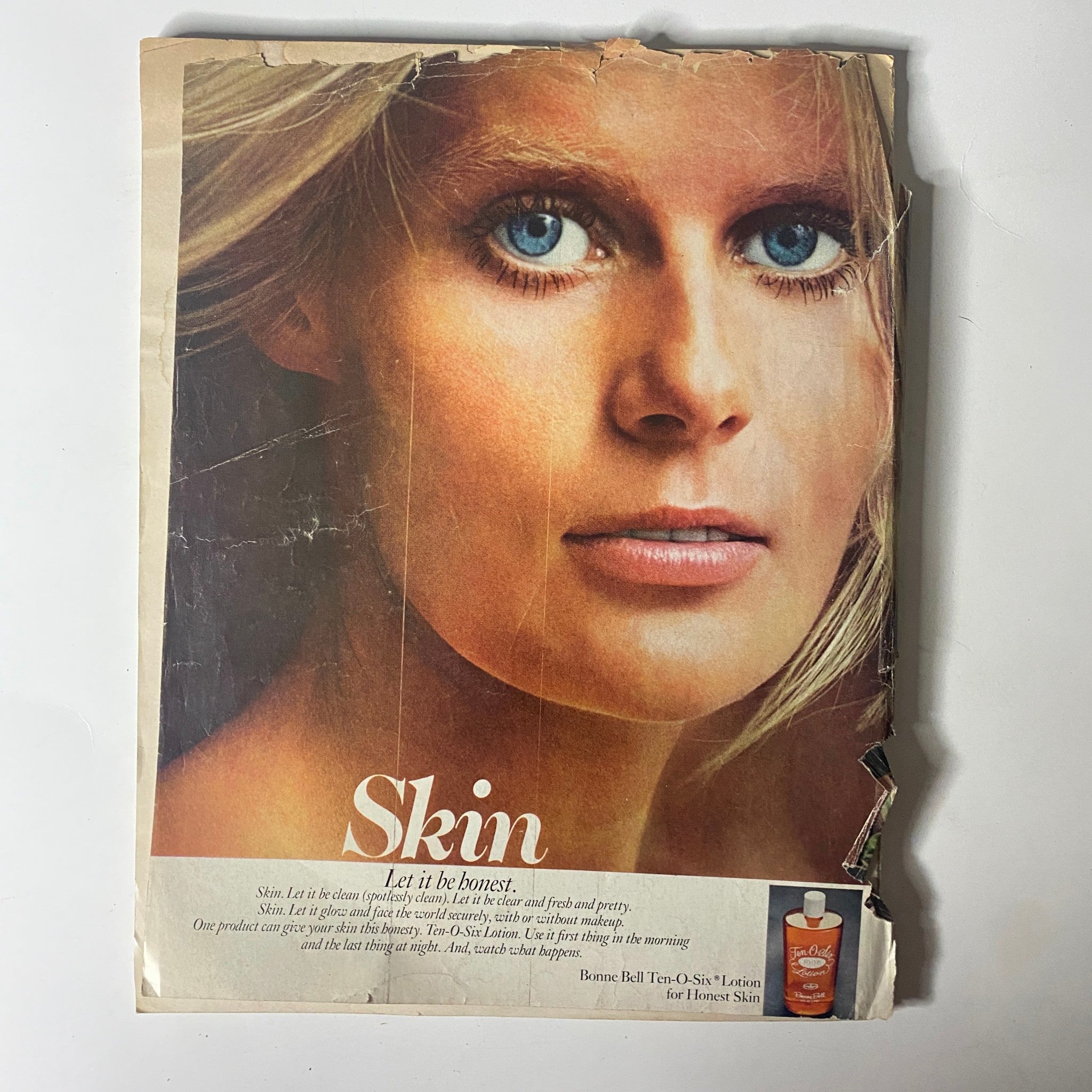 Cover of a beauty advertisement focused on skin care products. The image features a model with striking blue eyes and a natural look, promoting the message of honesty in skin care from Vogue Magazine - November 1, 1971.