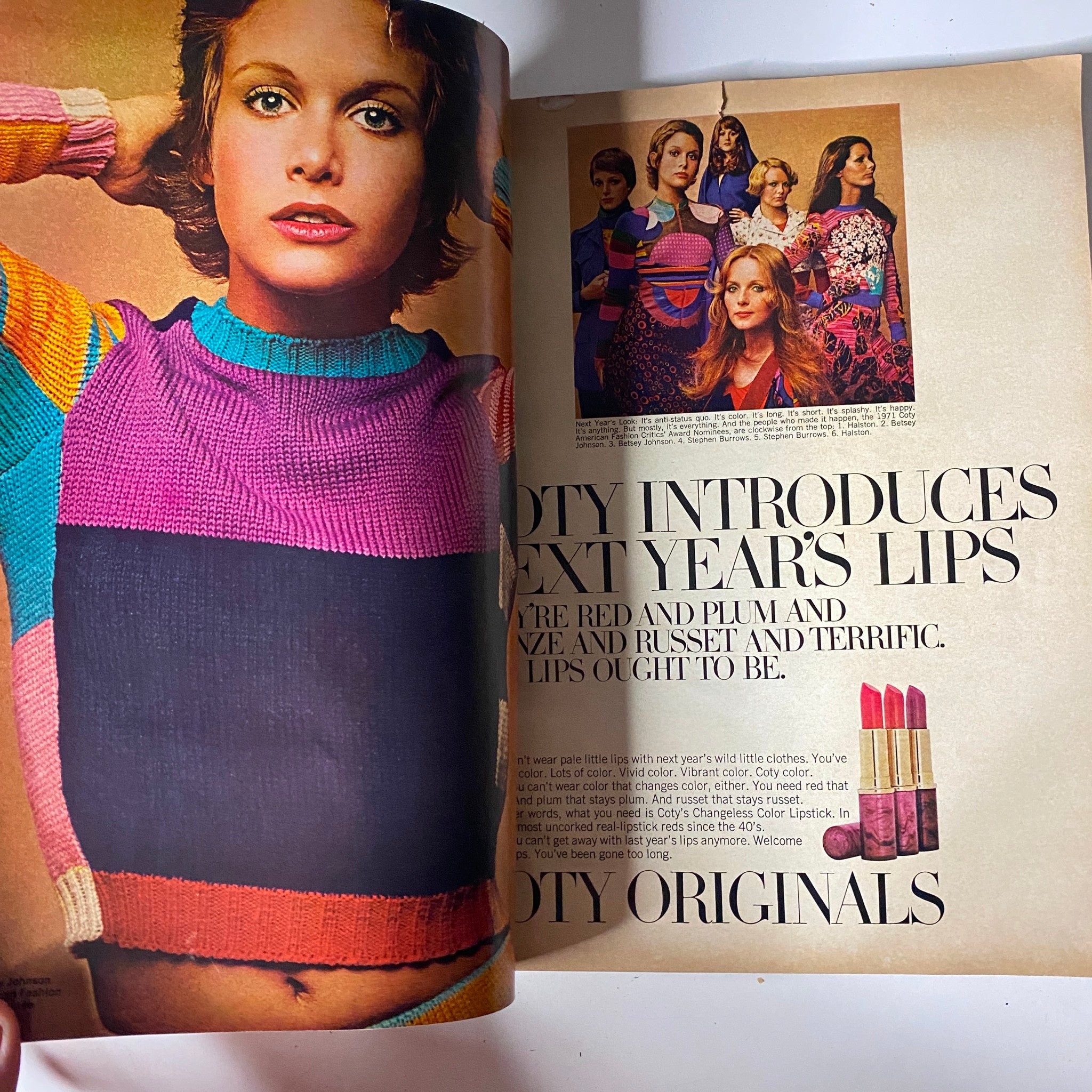 Interior page from Vogue Magazine, October 1, 1971, featuring a model showcasing Coty lipstick colors, representing the makeup trends of the era.