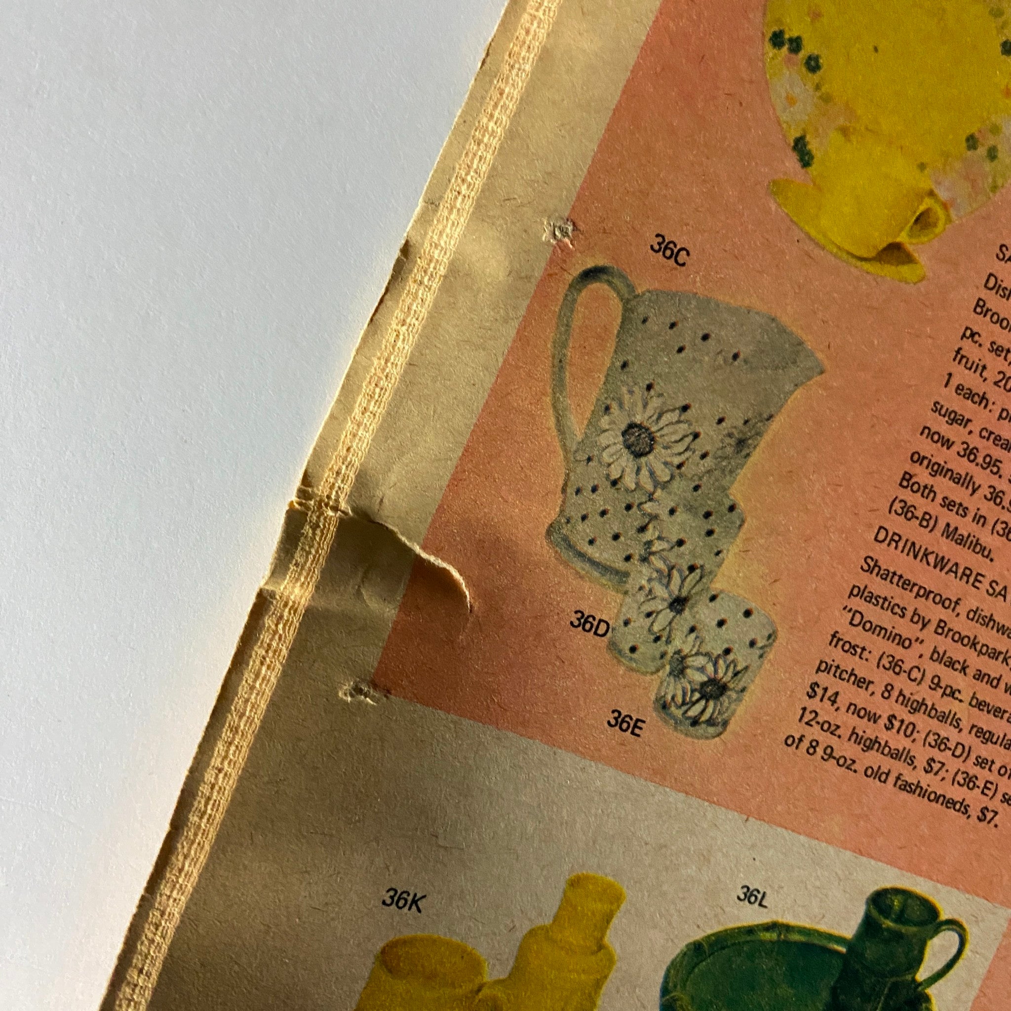 Close-up detail of ceramic pitcher and cup showcasing unique floral designs, from The New York Times Magazine Bloomingdale's No Label.