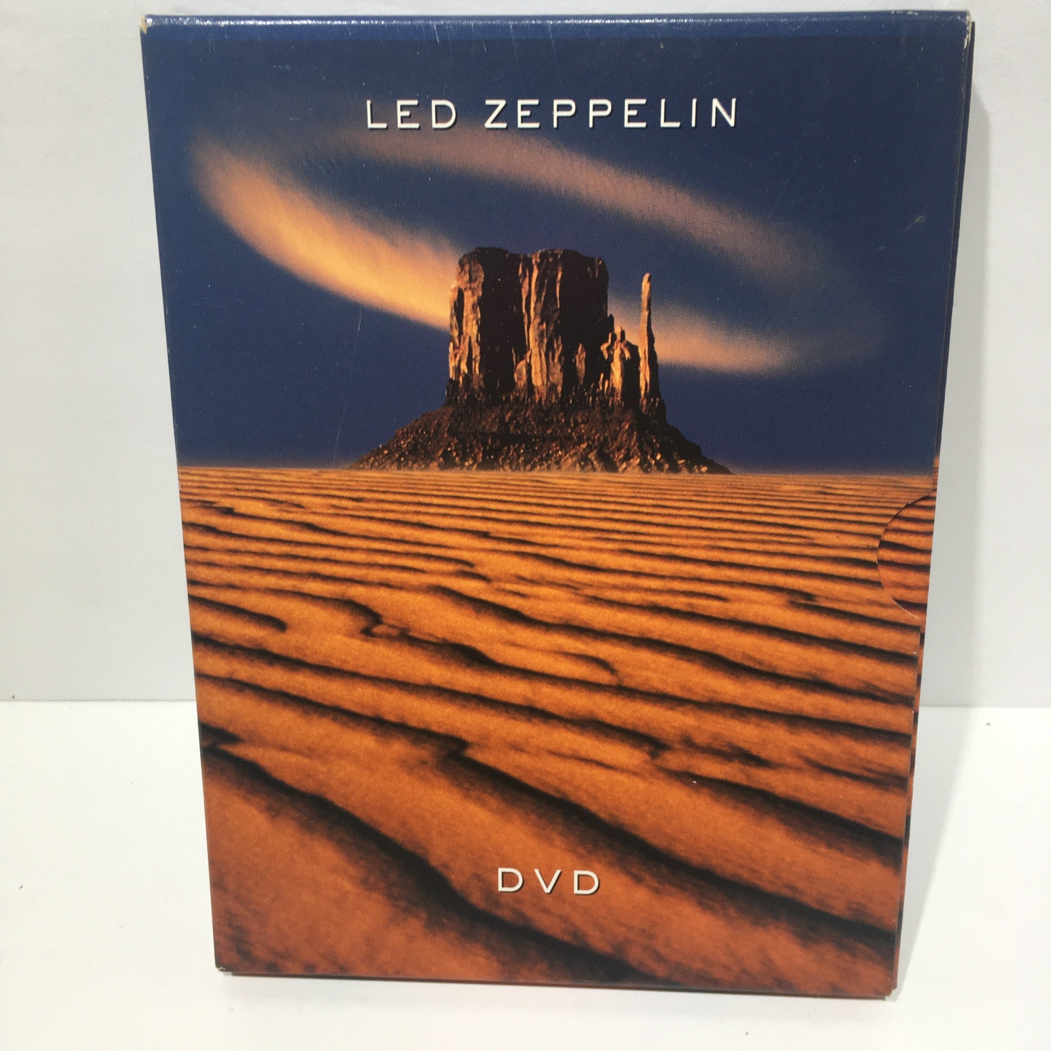 Front cover of the Led Zeppelin (2003) DVD featuring a desert landscape with a rock formation.
