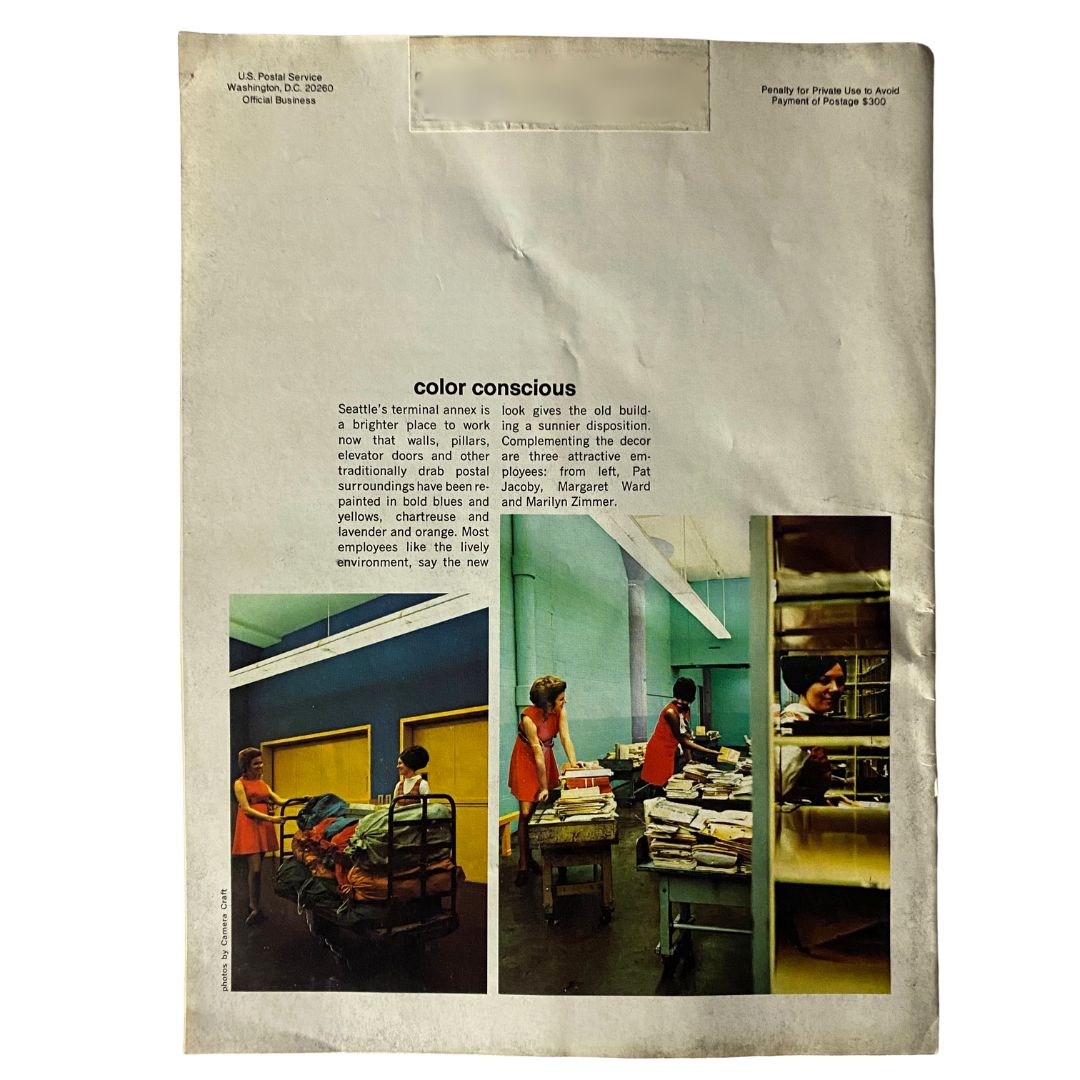 Back cover of VTG Postal Life Magazine May - June 1971 showcasing a colorful workspace at Seattle’s postal terminal with employees organizing mail.