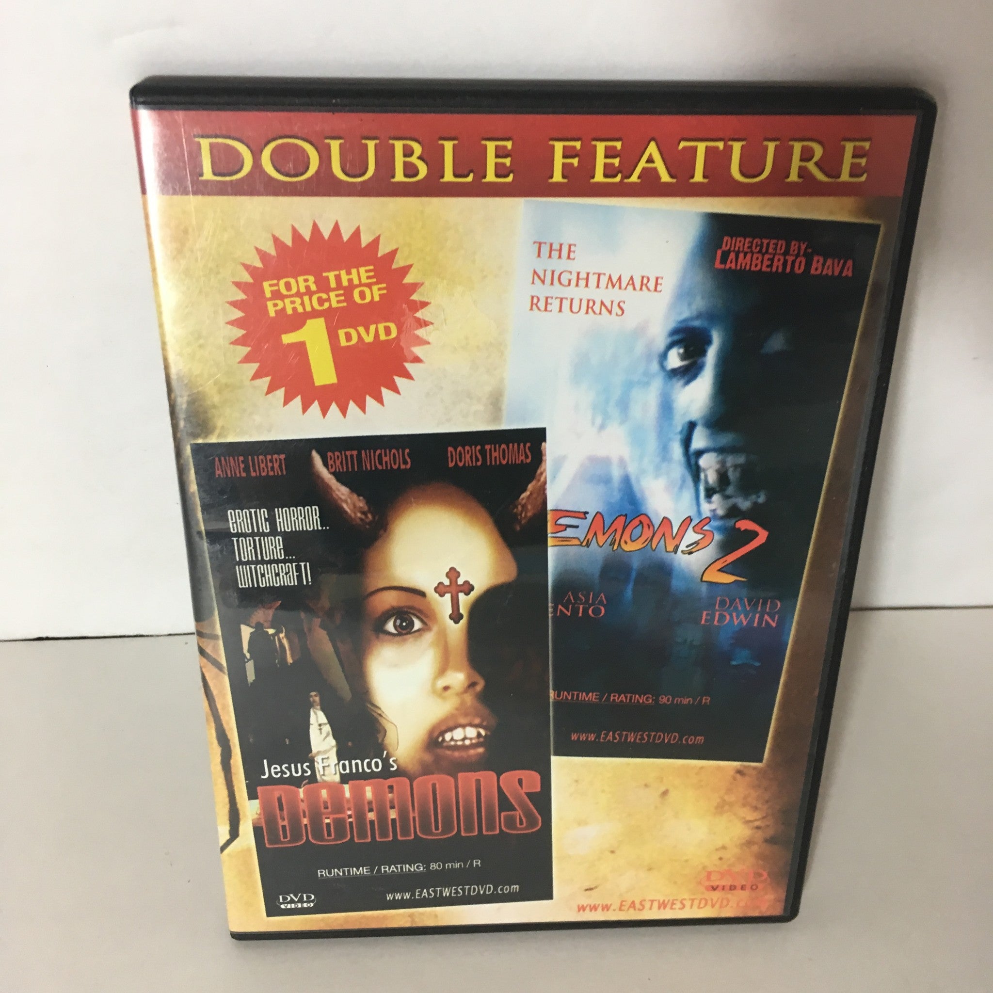 Demons/Demons 2 Double Feature DVD cover featuring an image of a woman with a red cross, showcasing the films' titles and highlighting the double feature presentation. Ideal for horror movie enthusiasts.