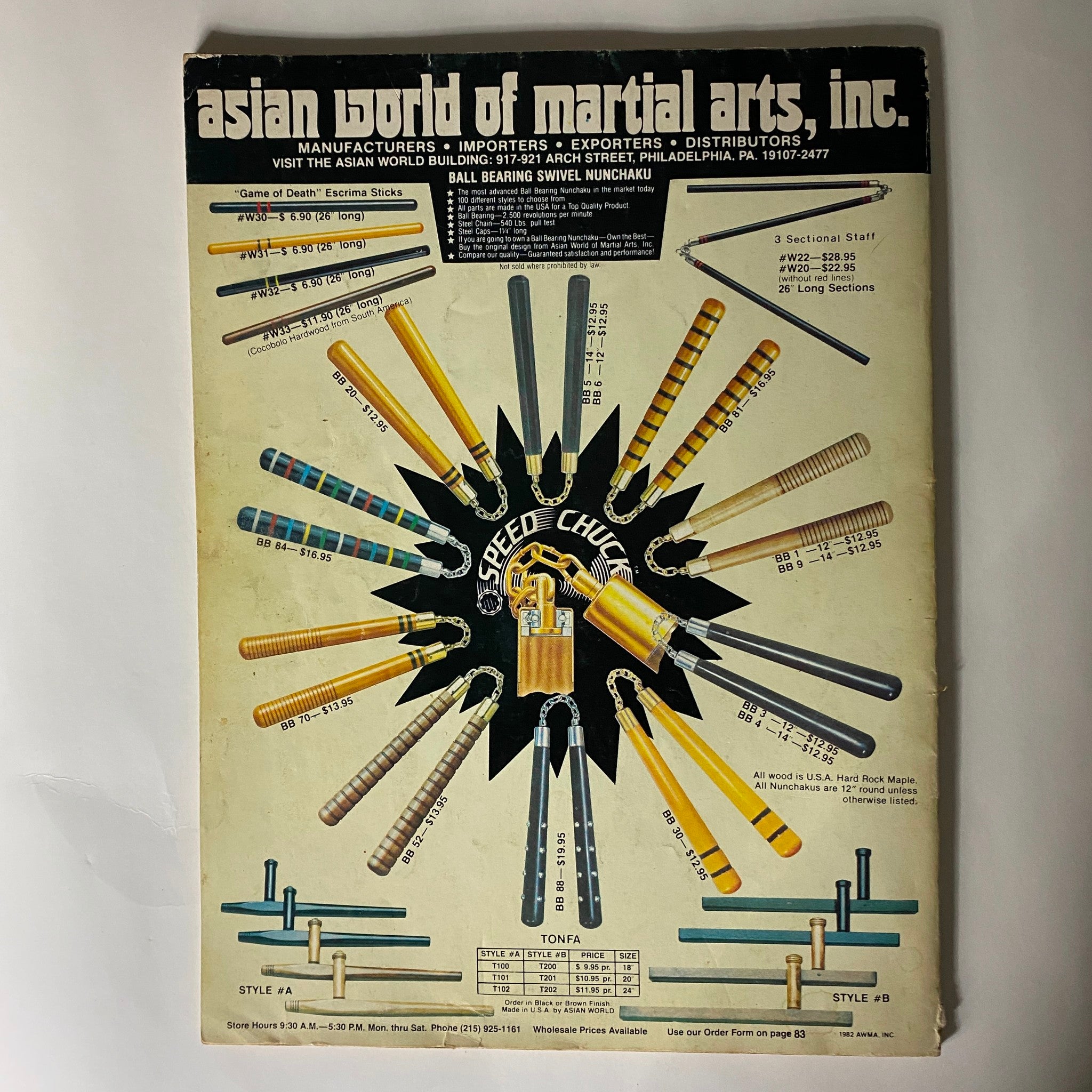 Back cover of the VTG Karate Illustrated Magazine Yearbook 1983 showcasing various martial arts equipment from Asian World of Martial Arts, including nunchaku and tonfa.