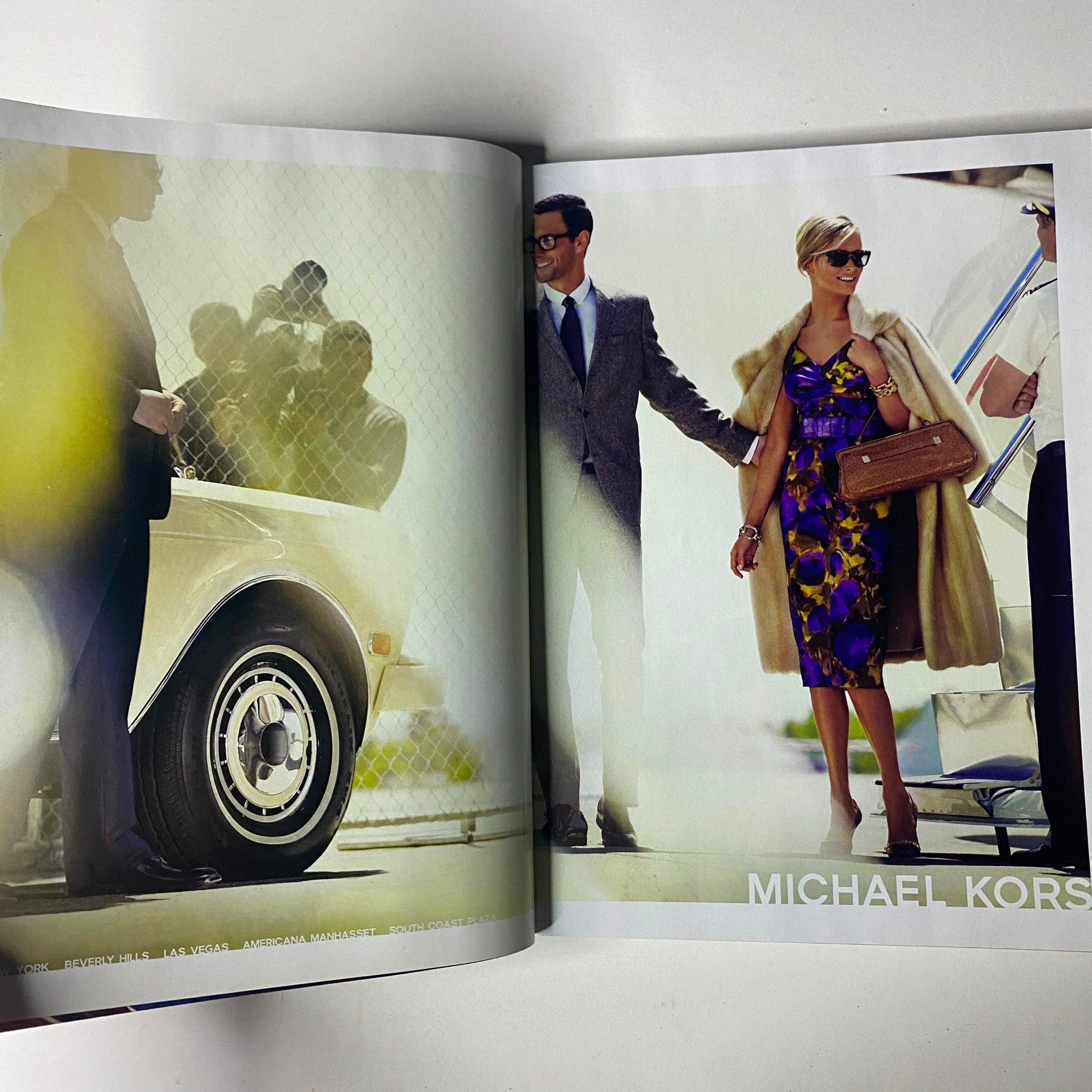 Spread featuring a stylish couple next to a vintage car, highlighting a Michael Kors fashion advertisement from Vogue Magazine August 2008.