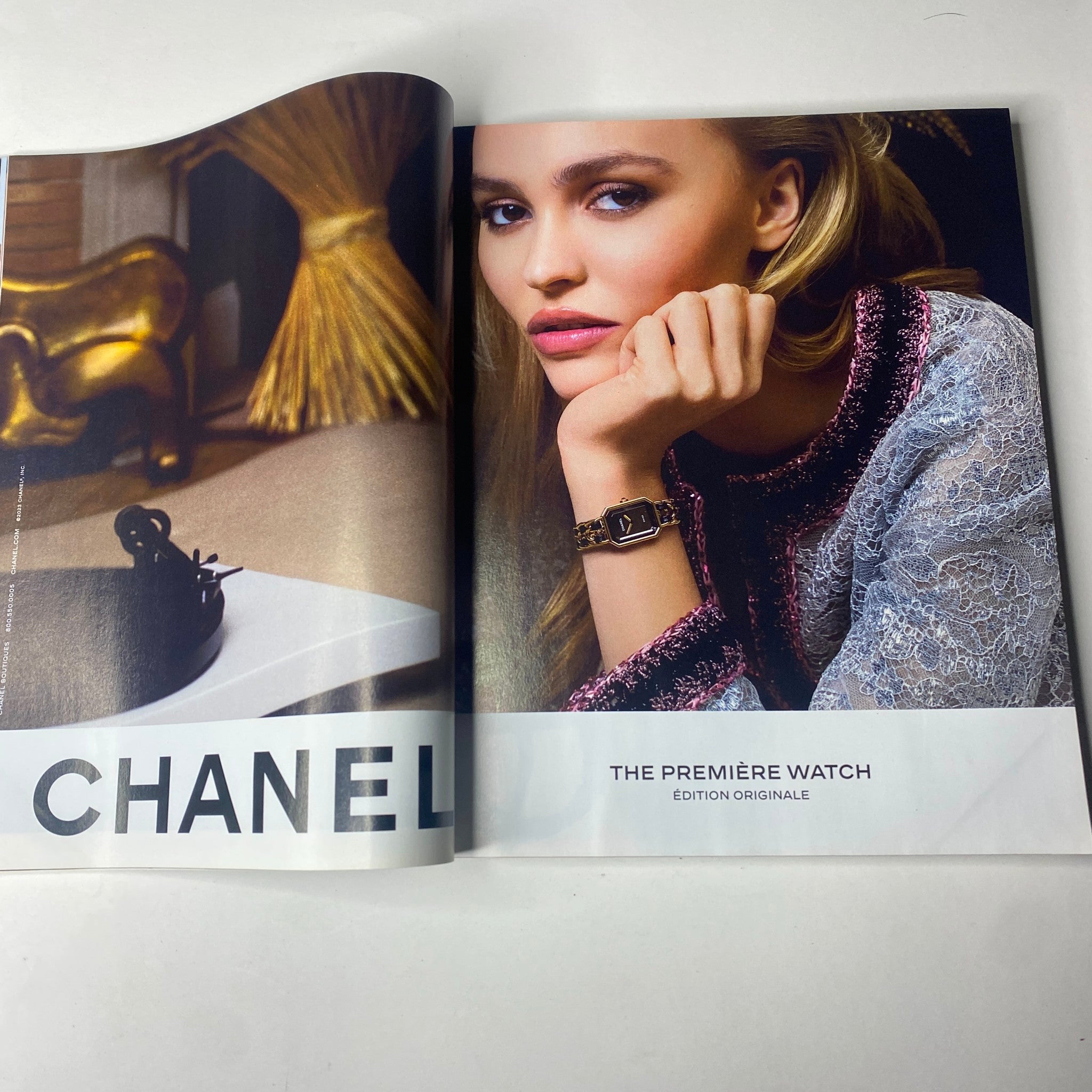 Fashion editorial spread from Vogue Magazine September 2023 featuring a model showcasing a Chanel watch, emphasizing luxury accessories in contemporary style.
