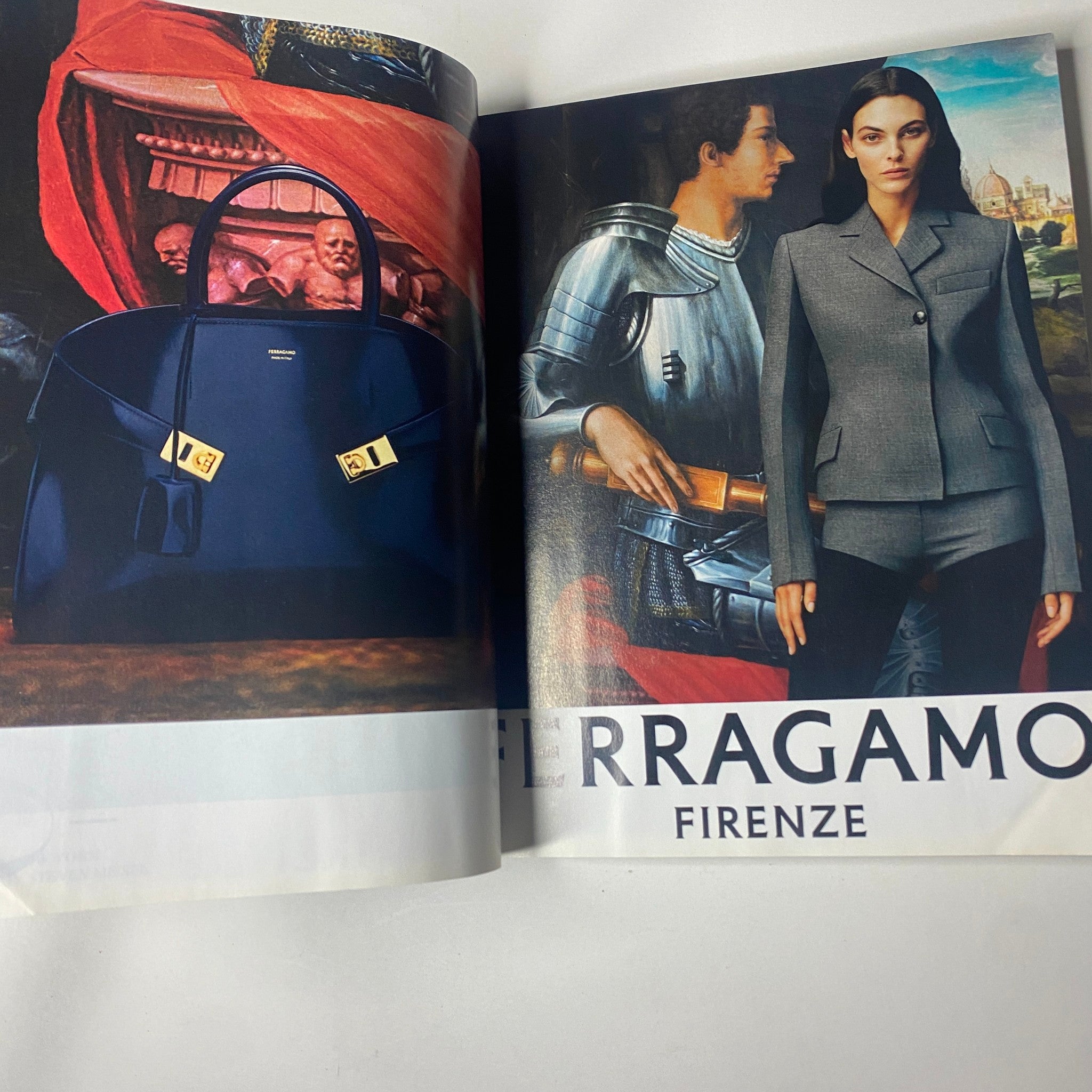 Vogue Magazine September 2023 featuring a high-fashion advertisement for Ferragamo Firenze, showcasing a stylish handbag and a model in a tailored outfit amidst a classic artistic backdrop.