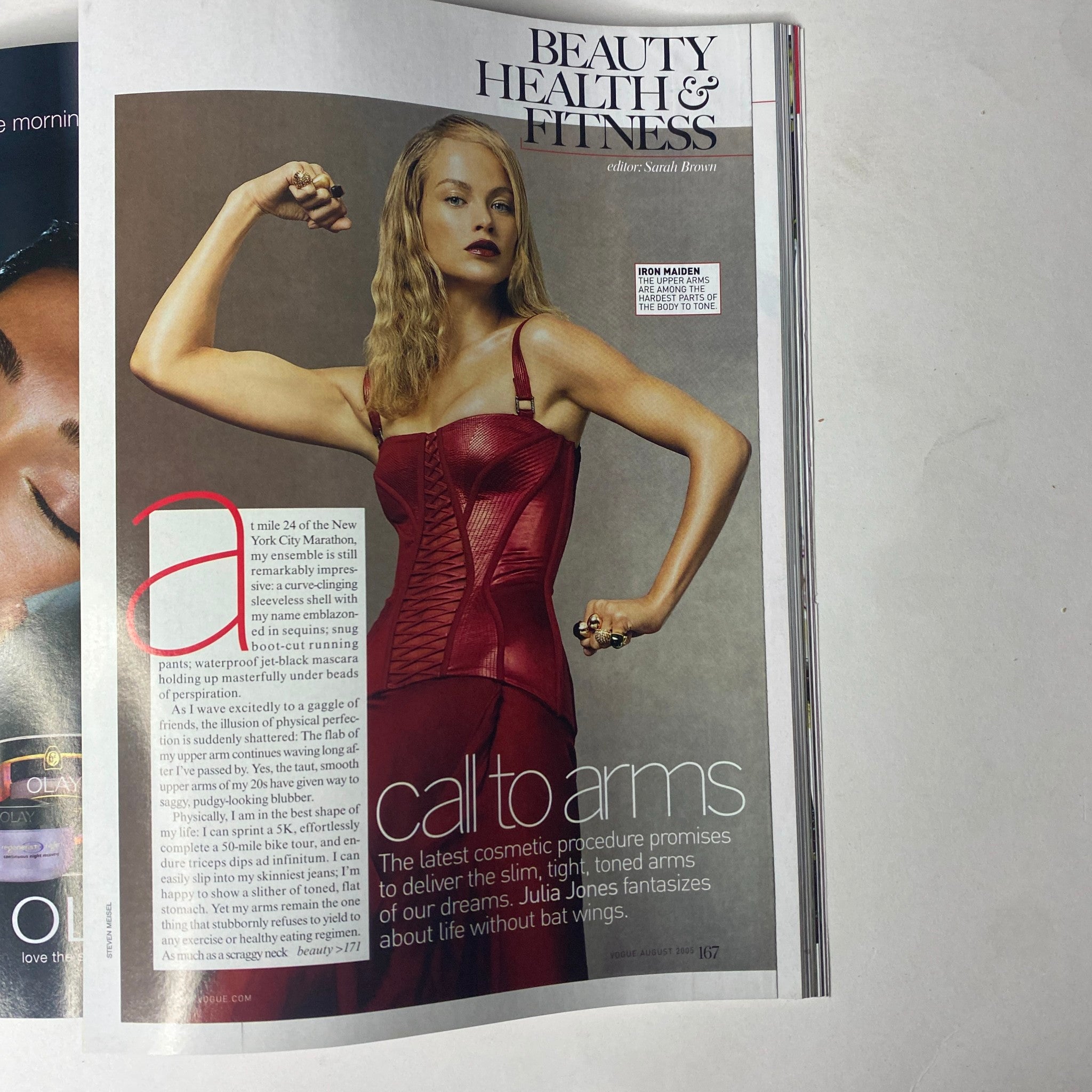 Vogue Magazine August 2005 features Madonna on the cover, showcasing beauty and fitness with a segment titled 'call to arms' discussing cosmetic procedures for toned arms.