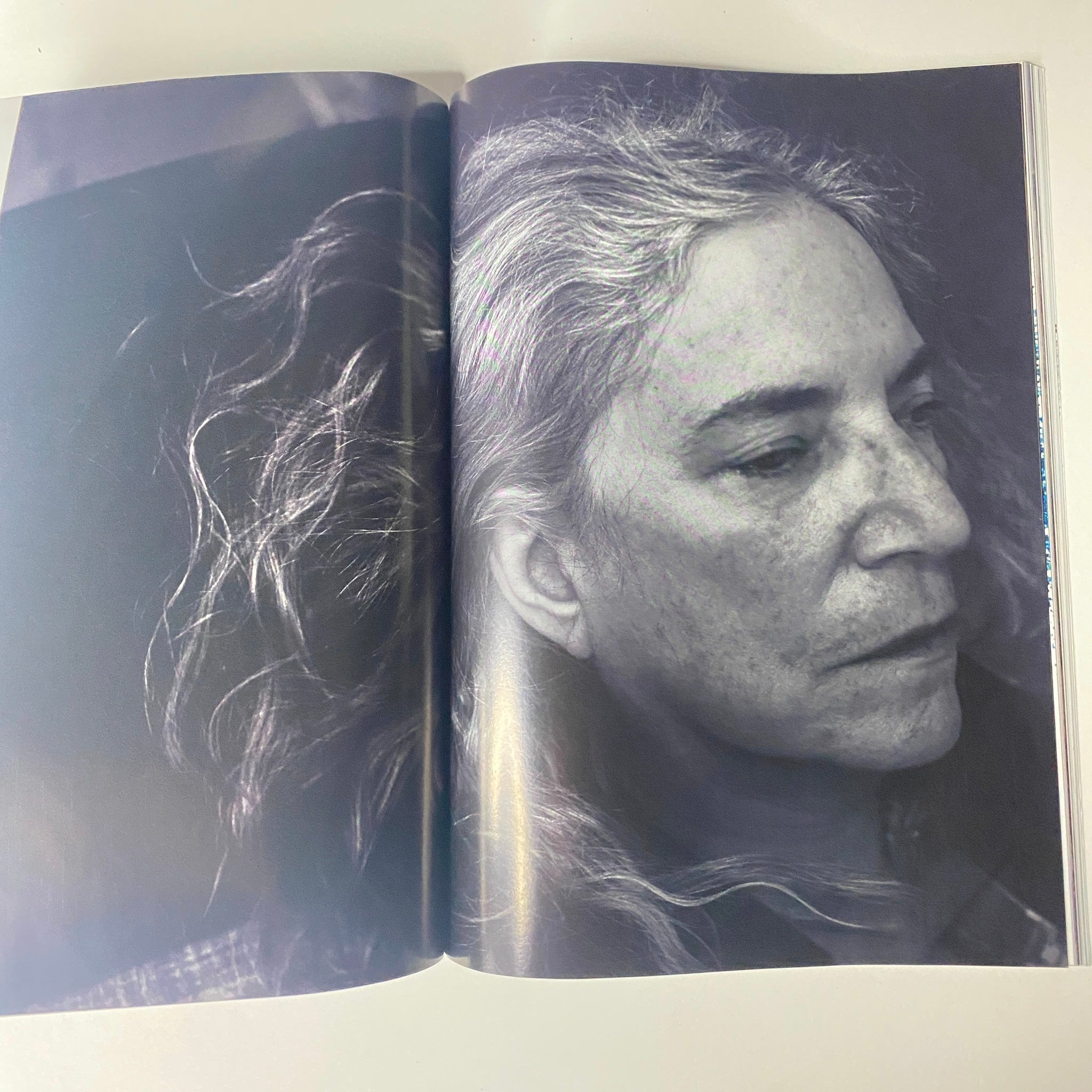 Portrait photo featured in Vogue Magazine November 2016 showing a close-up of a woman with gray hair, part of the features in the Emma Stone cover issue.