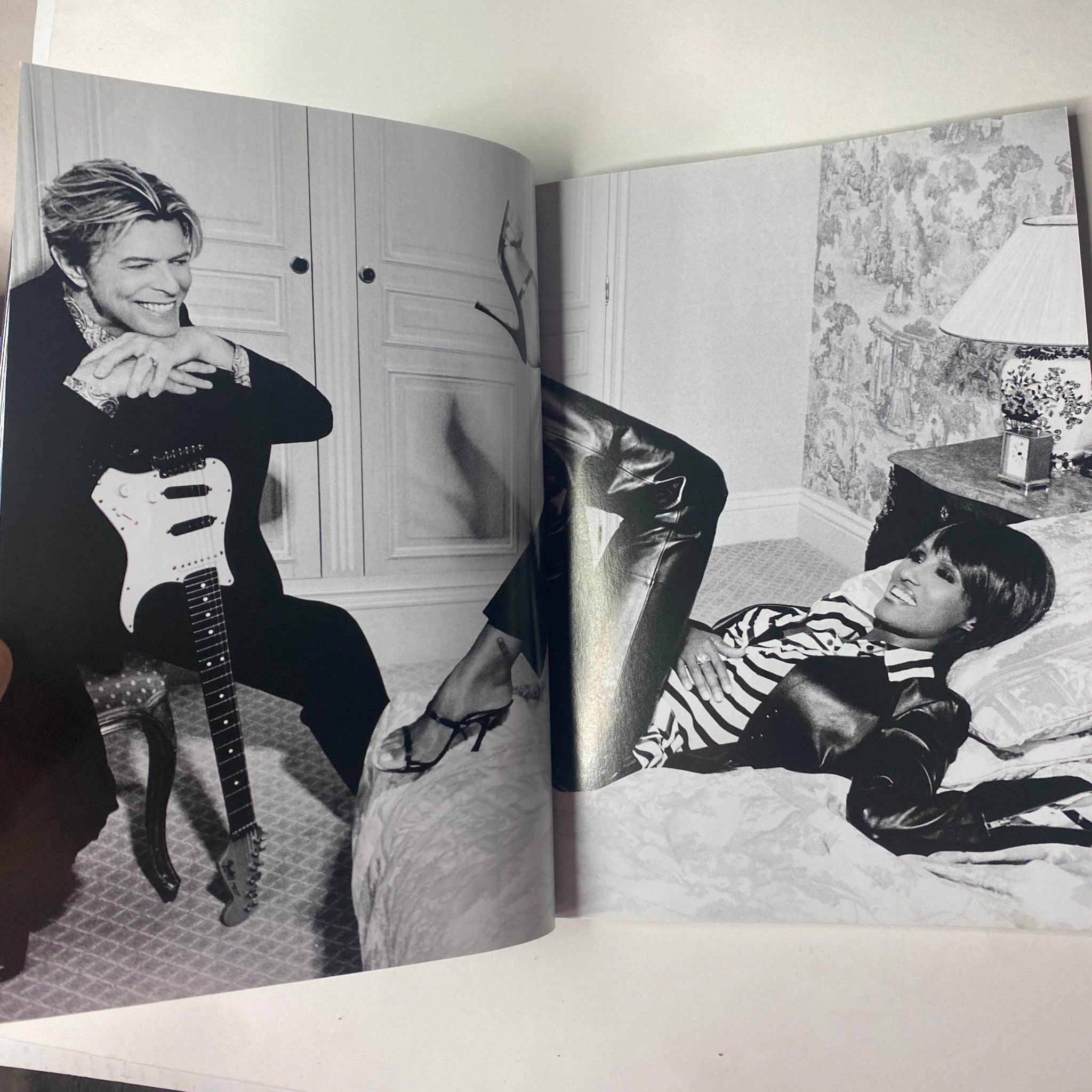 Spread in Vogue Magazine May 2004 featuring David Bowie and a model, highlighting a stylish black and white editorial photo.