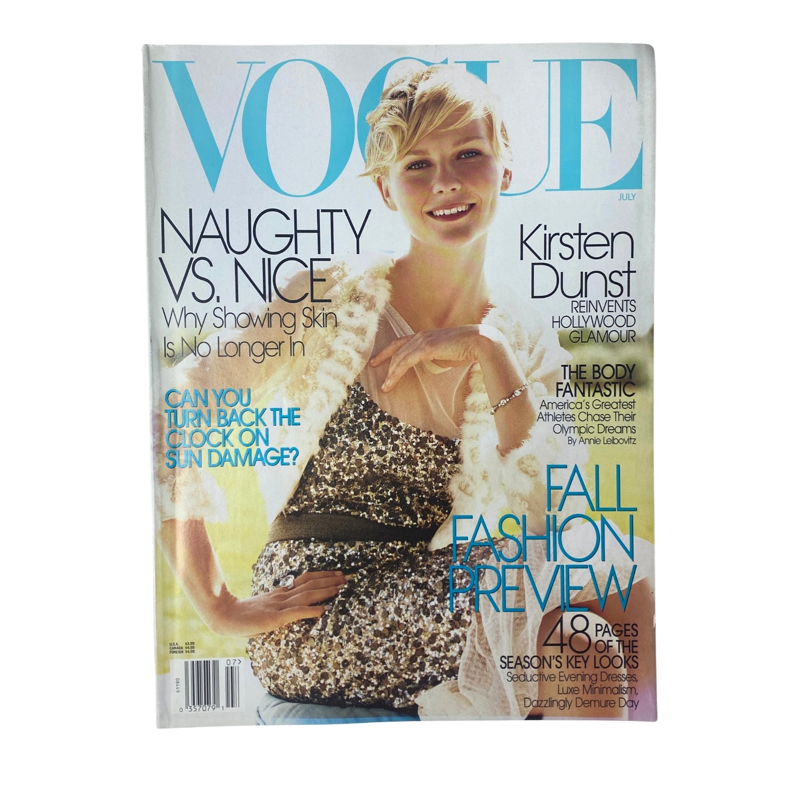 Vogue Magazine July 2004 issue featuring Kirsten Dunst on the cover with the title "Vogue" prominently displayed; highlights glamour and summer fashion.