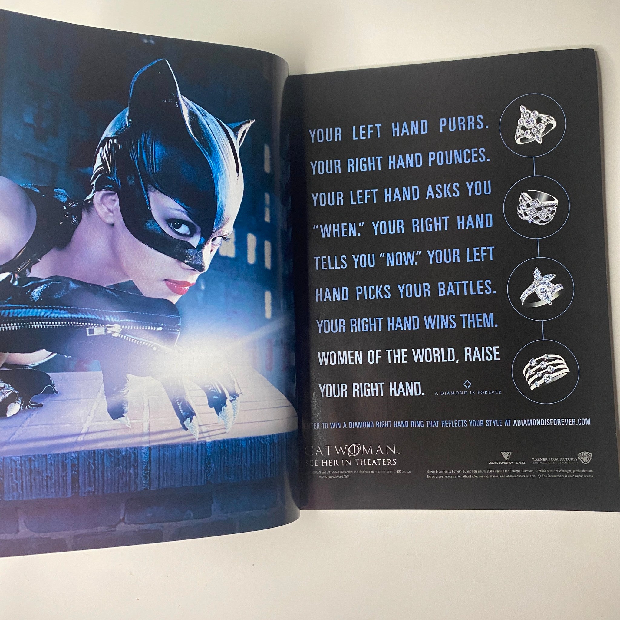 Ad page in Vogue Magazine July 2004, featuring a striking image of a cat-themed female character with the tagline about women's empowerment and style.