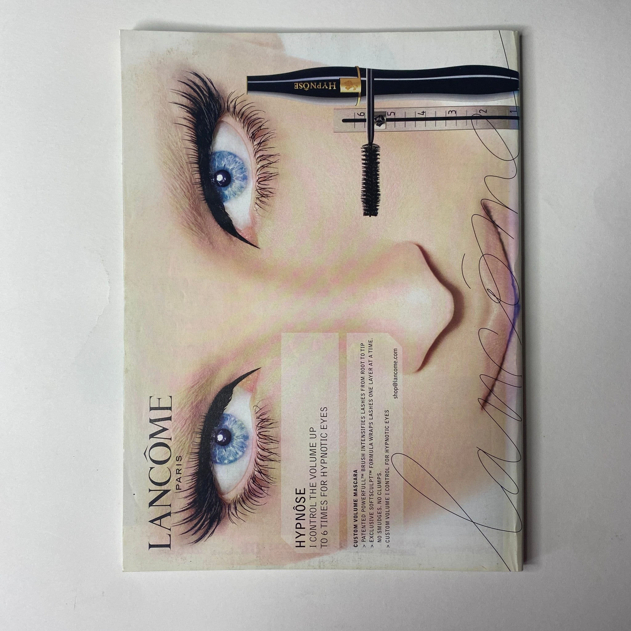 Vogue Magazine January 2005 advertisement for Lancôme Hypnôse mascara, featuring a close-up of an eye with bold lashes, promoting beauty products.
