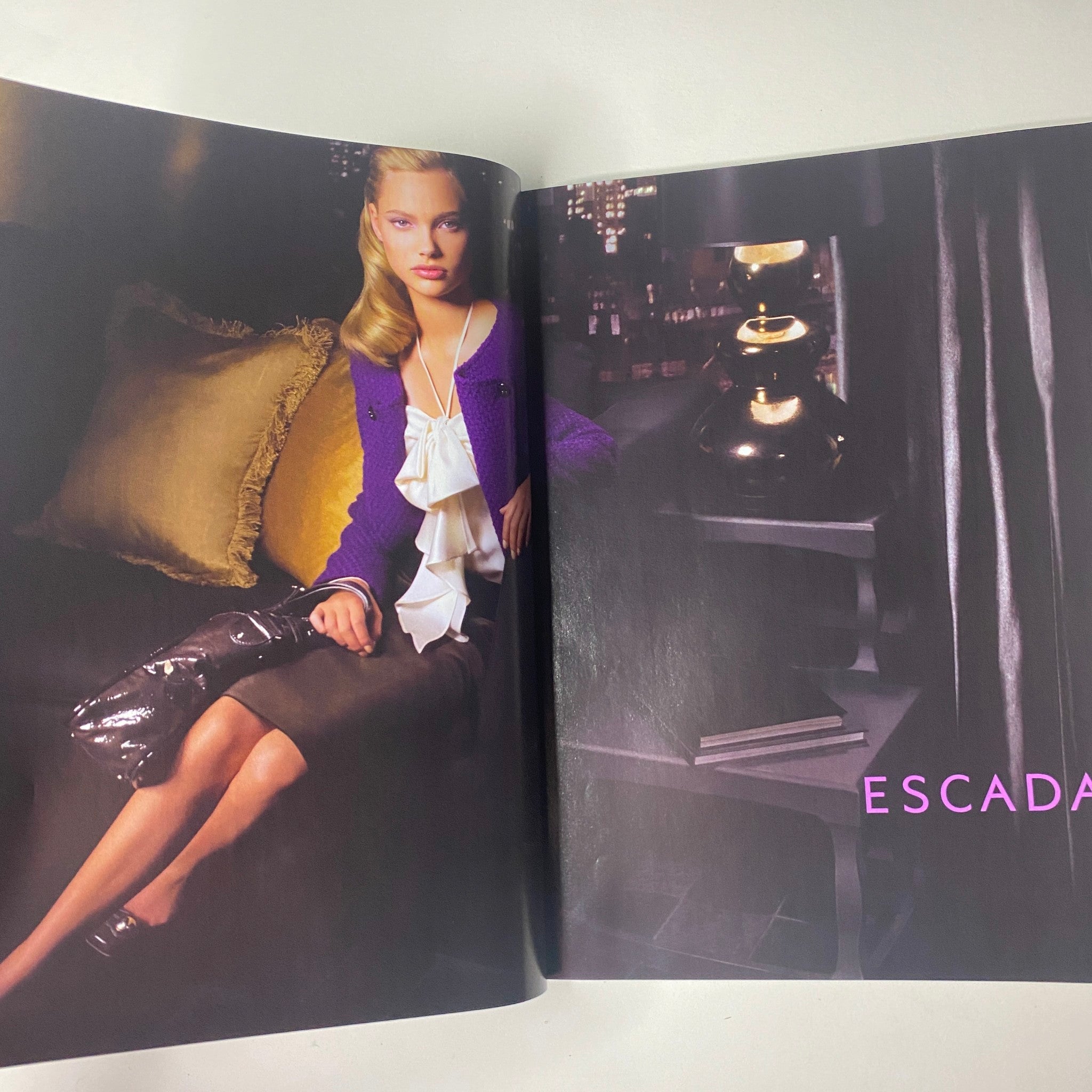 Fashion spread from Vogue Magazine July 2007 featuring an Escada advertisement alongside a model in elegant attire.