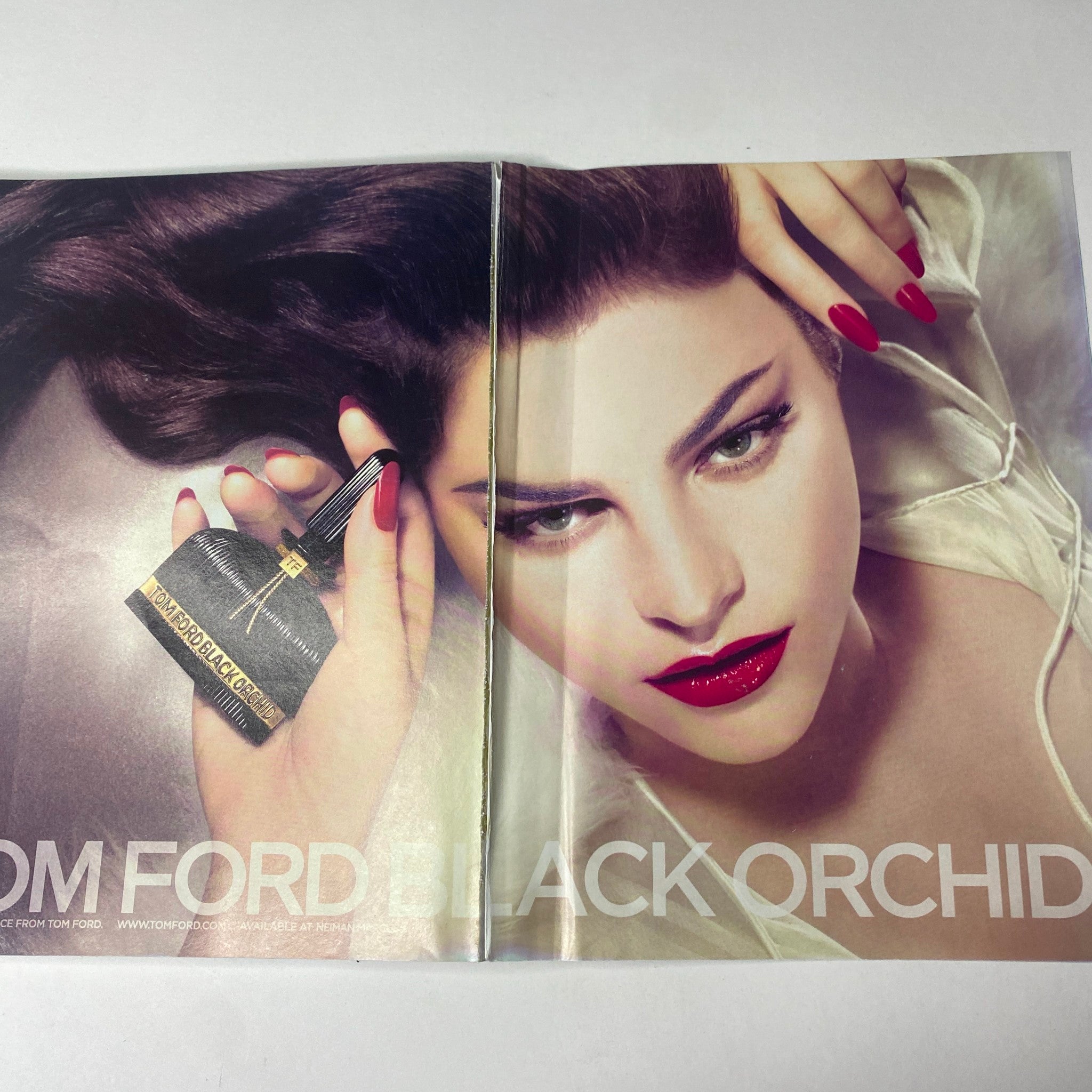 Vogue Magazine February 2007 Renée Zellweger Cover showcasing a luxurious Tom Ford Black Orchid advertisement with a glamorous model, emphasizing beauty and elegance.