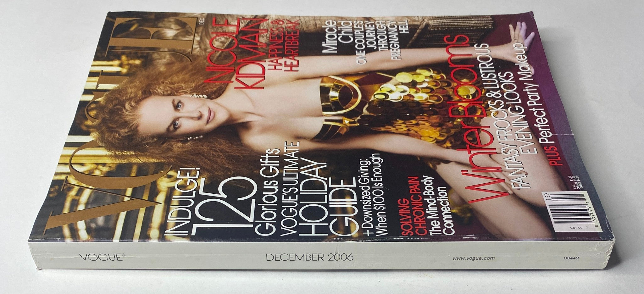 Back cover view of Vogue Magazine December 2006 with Nicole Kidman, includes details about the magazine's contents and layout.