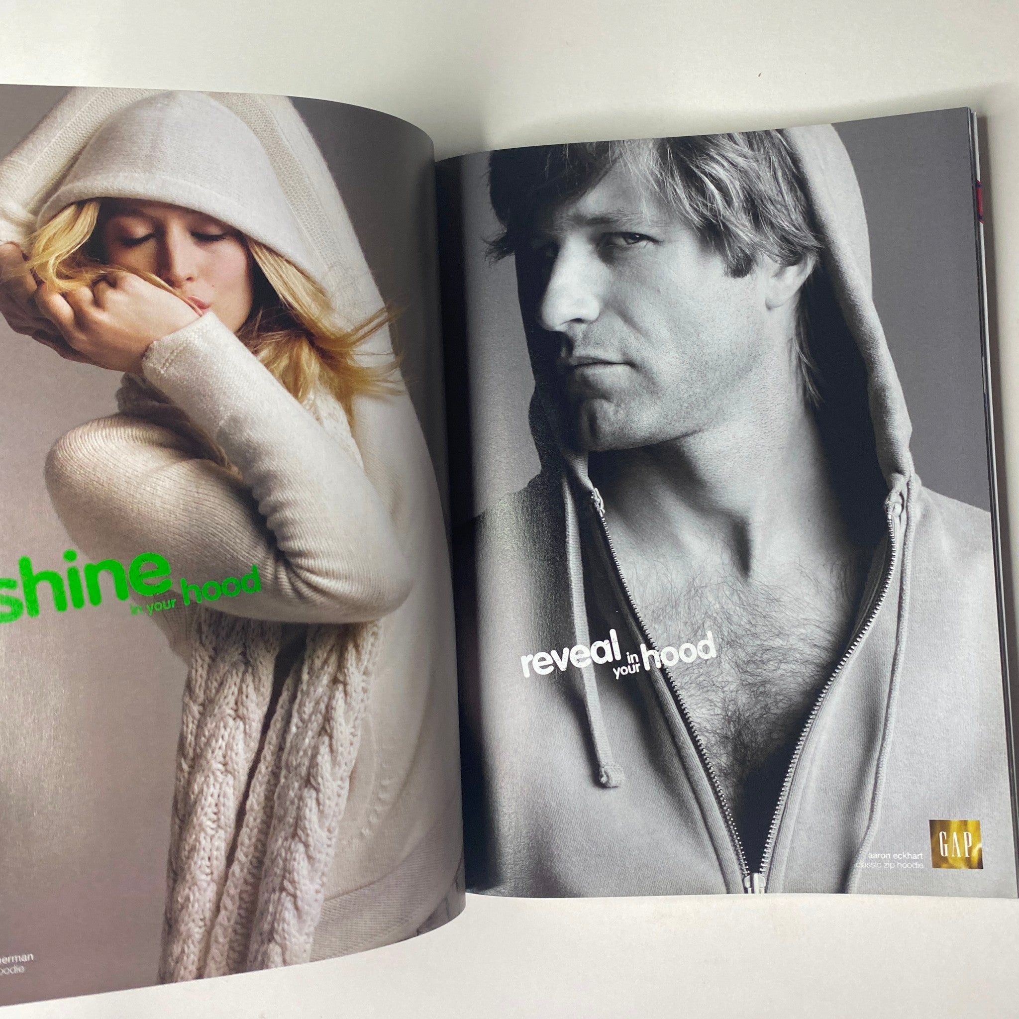 Vogue Magazine December 2006 presents a fashion spread featuring models in stylish hooded apparel, illustrating contemporary fashion trends.