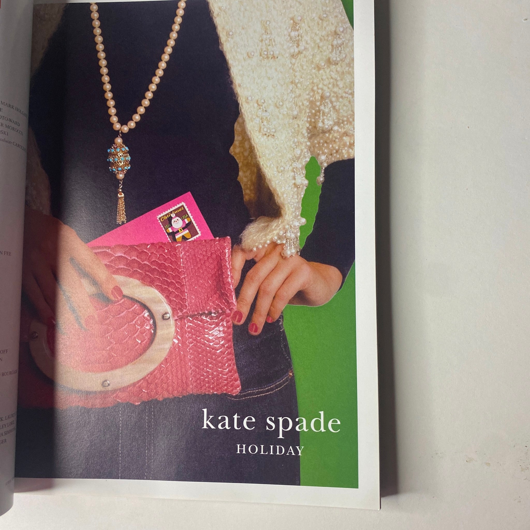 Vogue Magazine December 2006 showcases a page dedicated to Kate Spade holiday fashion with an elegant presentation of accessories and style recommendations.