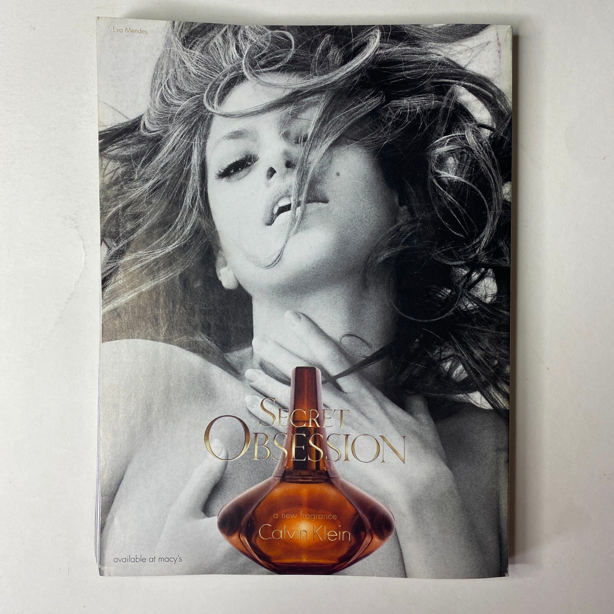 Vogue Magazine October 2008 showcasing a striking black and white advertisement for Calvin Klein's 'Secret Obsession' fragrance, featuring a dramatic image of a woman.