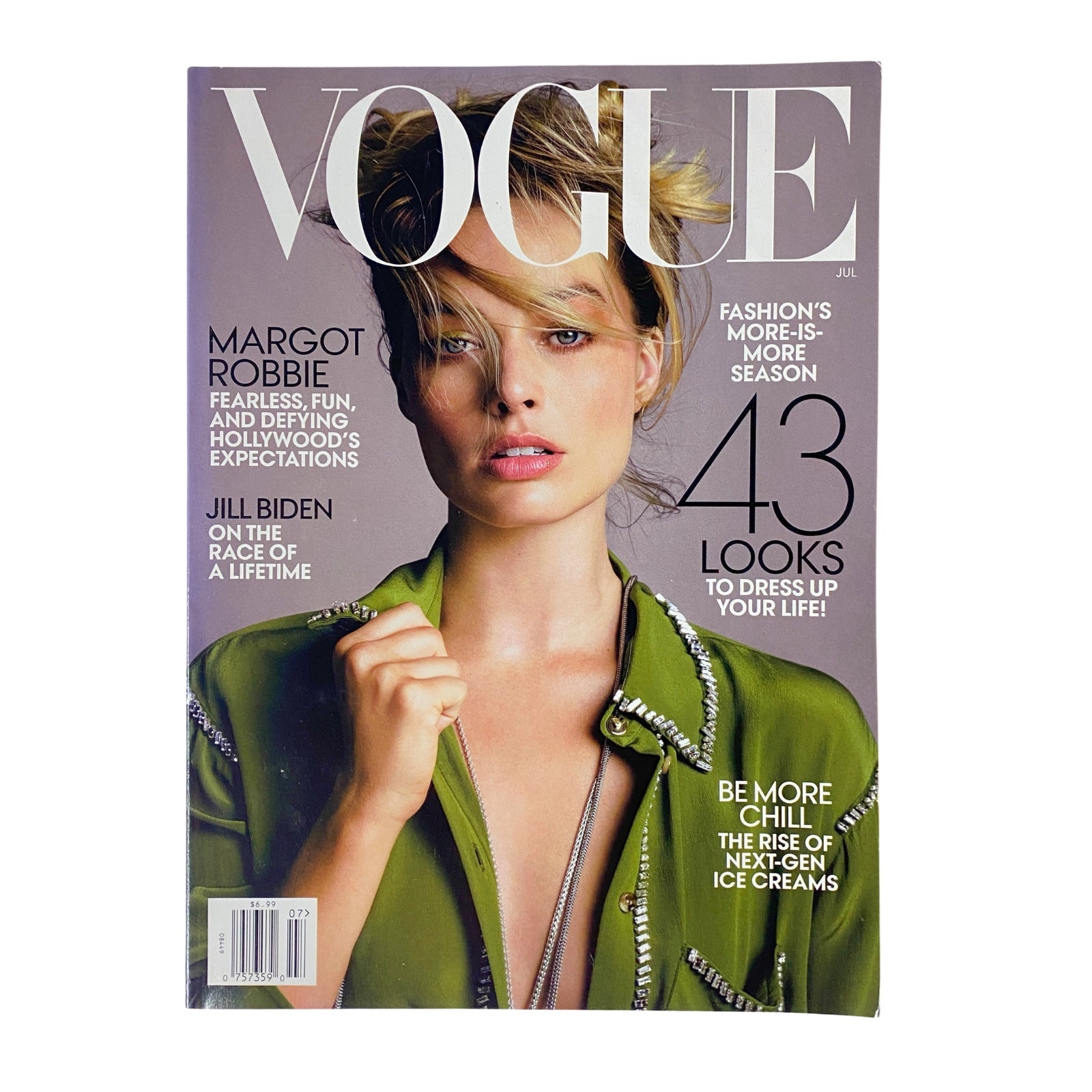Cover of Vogue Magazine July 2019 featuring Margot Robbie. The cover highlights her confident look with the headline 'Margot Robbie: Fearless, Fun, and Defying Hollywood’s Expectations' and includes features on fashion and lifestyle.