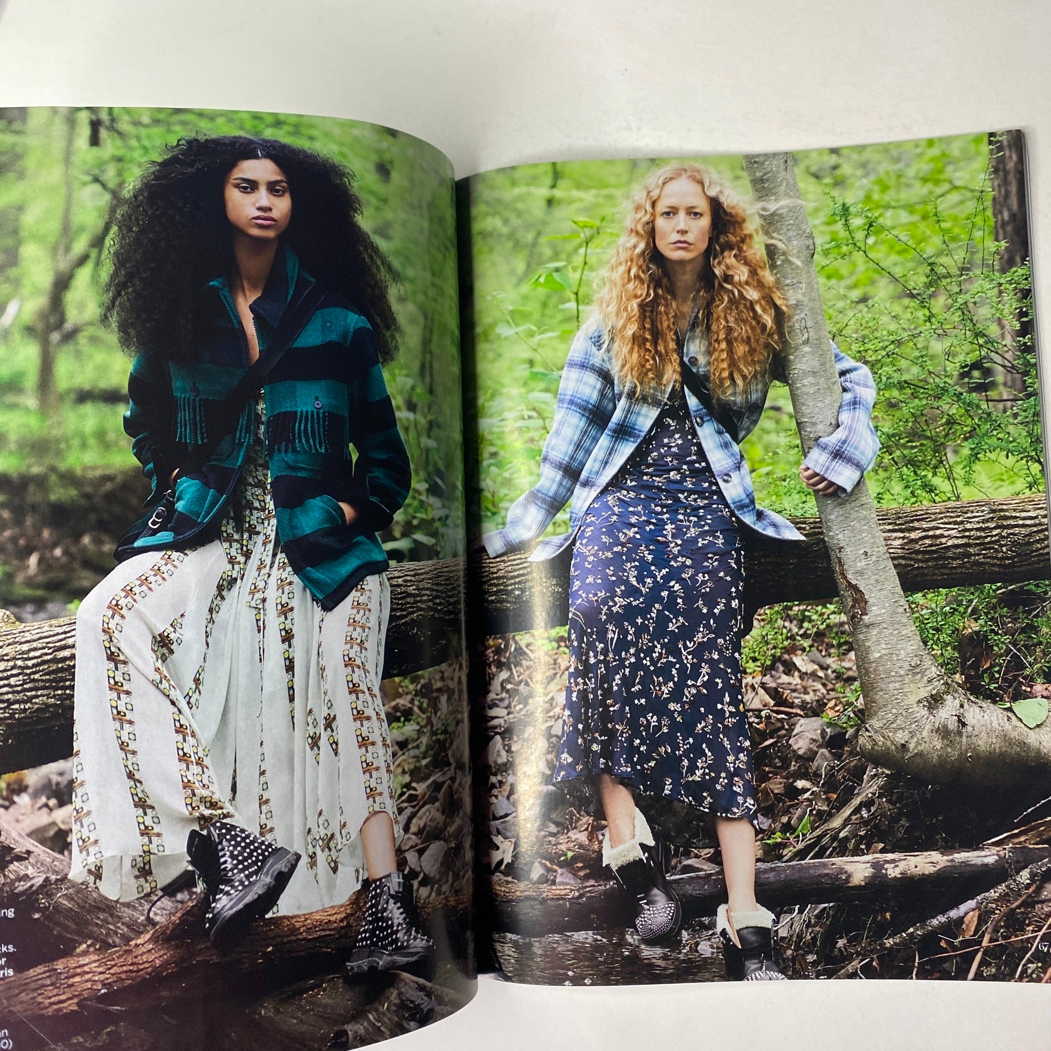 Fashion editorial spread from Vogue Magazine July 2019 showcasing two models in a natural setting, wearing stylish outfits, capturing the essence of modern femininity.