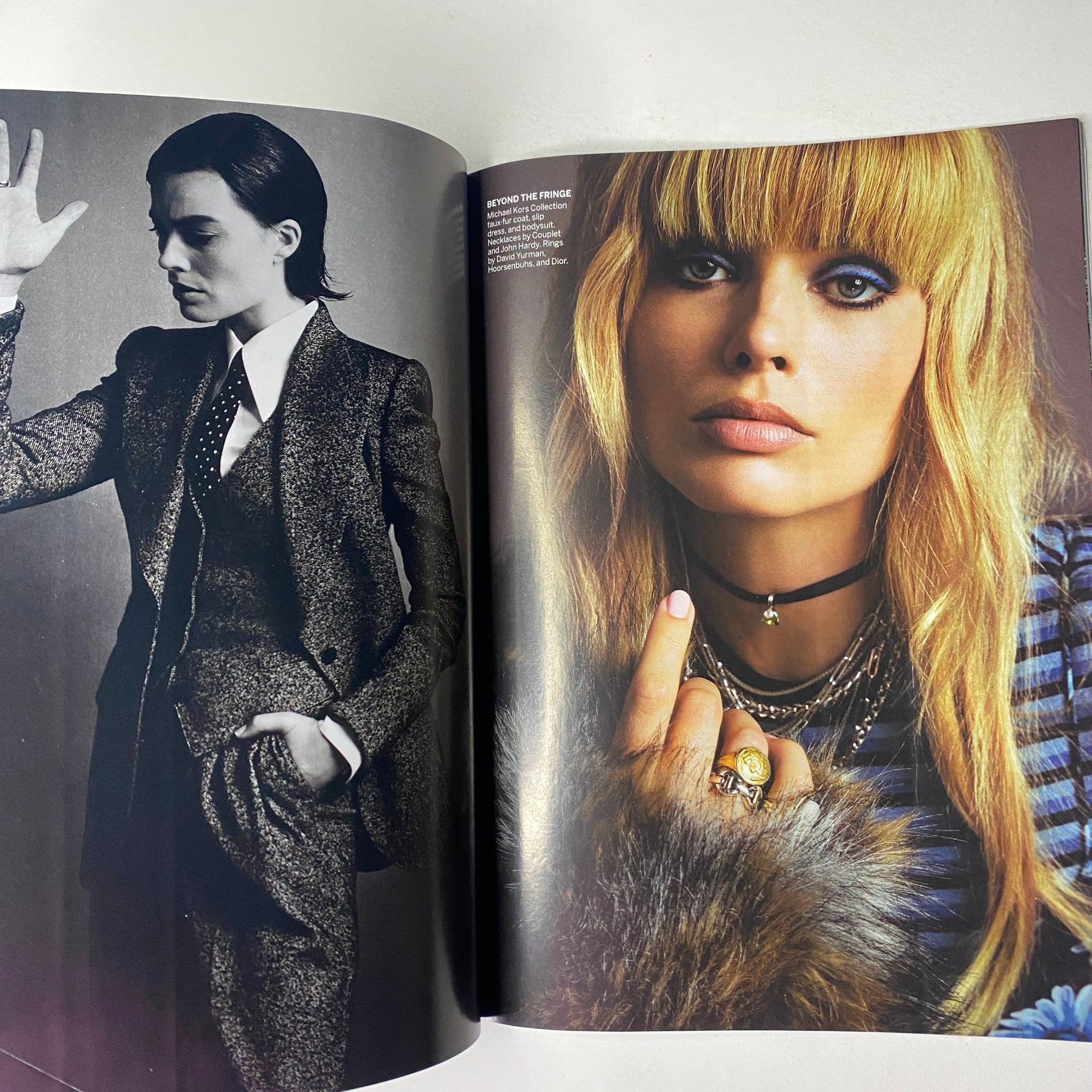 Editorial photo from Vogue Magazine July 2019 featuring a model in a tailored suit and vibrant makeup, representing a bold fashion statement.