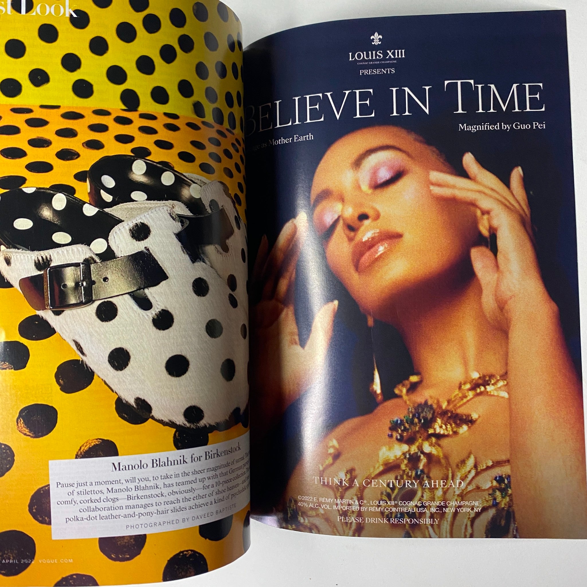 Louis XIII advertisement in Vogue Magazine April 2022, showcasing a model adorned in luxurious jewelry and fashion by Guo Pei.