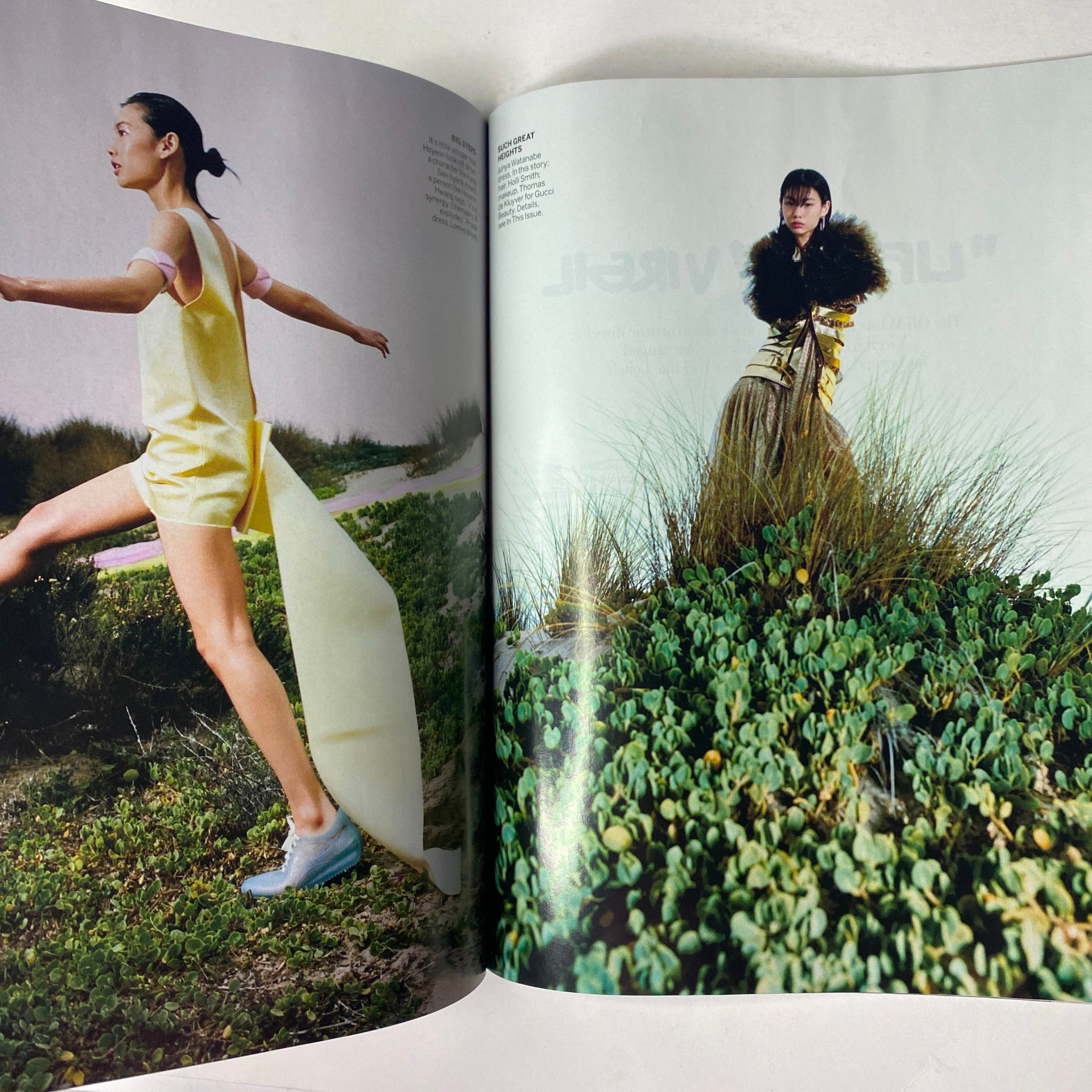 Vogue Magazine February 2022 showcasing a model in a vibrant yellow outfit and unique footwear, surrounded by lush greenery, highlighting innovative fashion designs.
