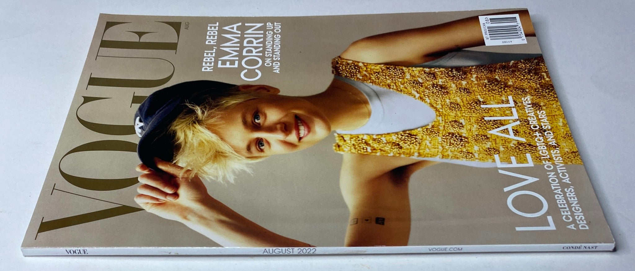 Vogue Magazine August 2022 cover featuring Emma Corrin wearing a stylish Louis Vuitton tank dress, celebrating individuality and bold expression.