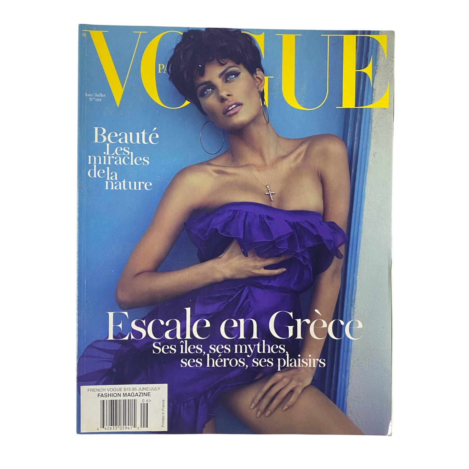 Cover of Vogue Paris Magazine, June-July 2011, No. 918 featuring Isabeli Fontana in a purple dress with the headline, 'Escale en Grèce'. The magazine highlights beauty and fashion themes, showcasing Mediterranean inspiration.
