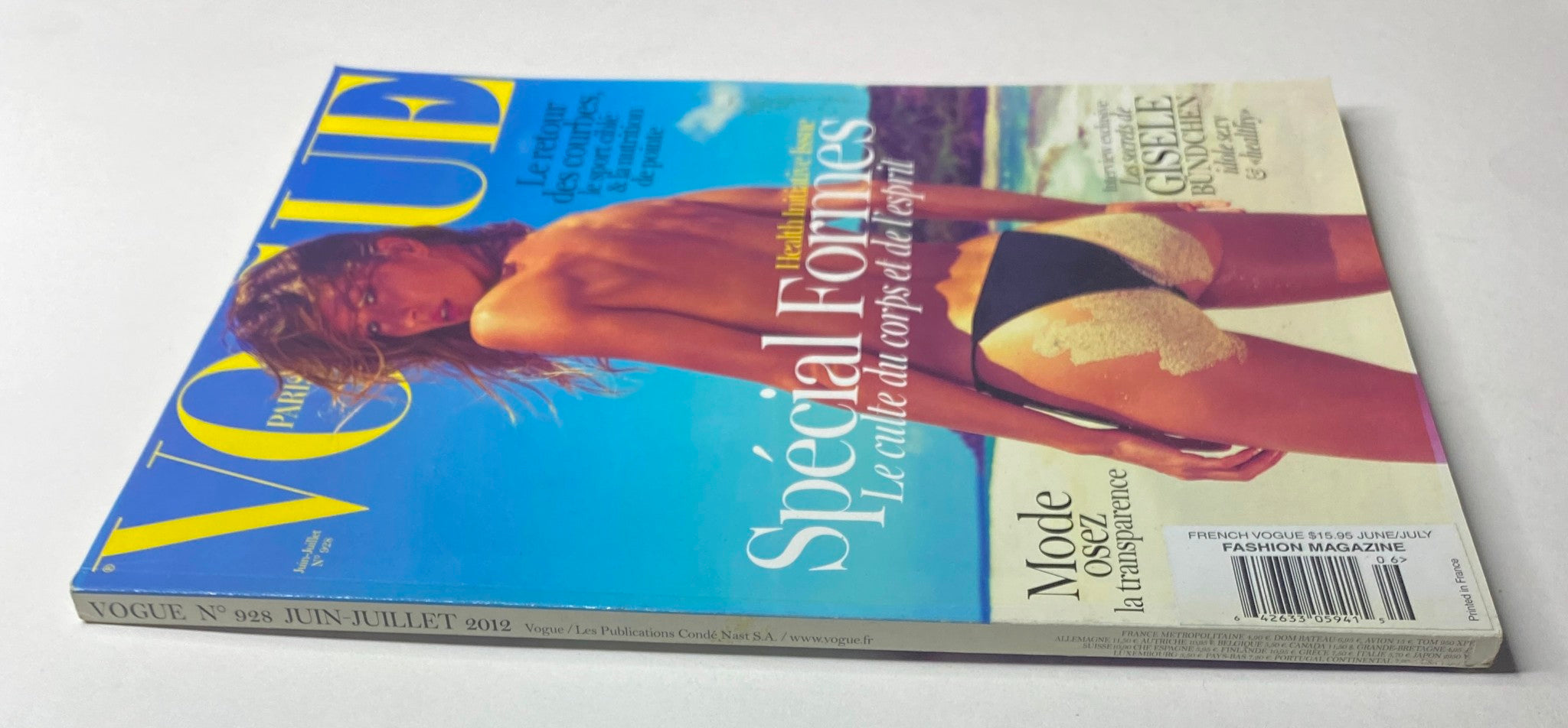 Back cover of Vogue Paris Magazine June - July 2012 No. 928 displaying Gisele Bündchen in a daring swimsuit, promoting a special initiative on health and body positivity.