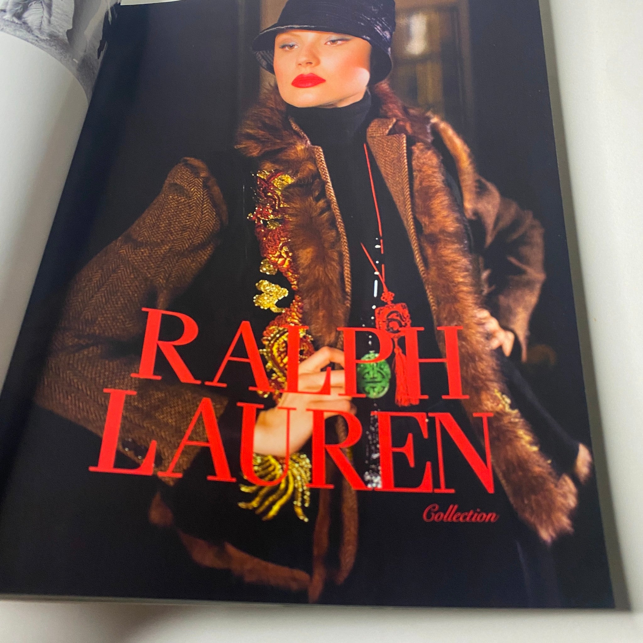 Ralph Lauren collection page from Vogue Paris Magazine, September 2011 No. 920, featuring a stylish model in a chic outfit with bold text.