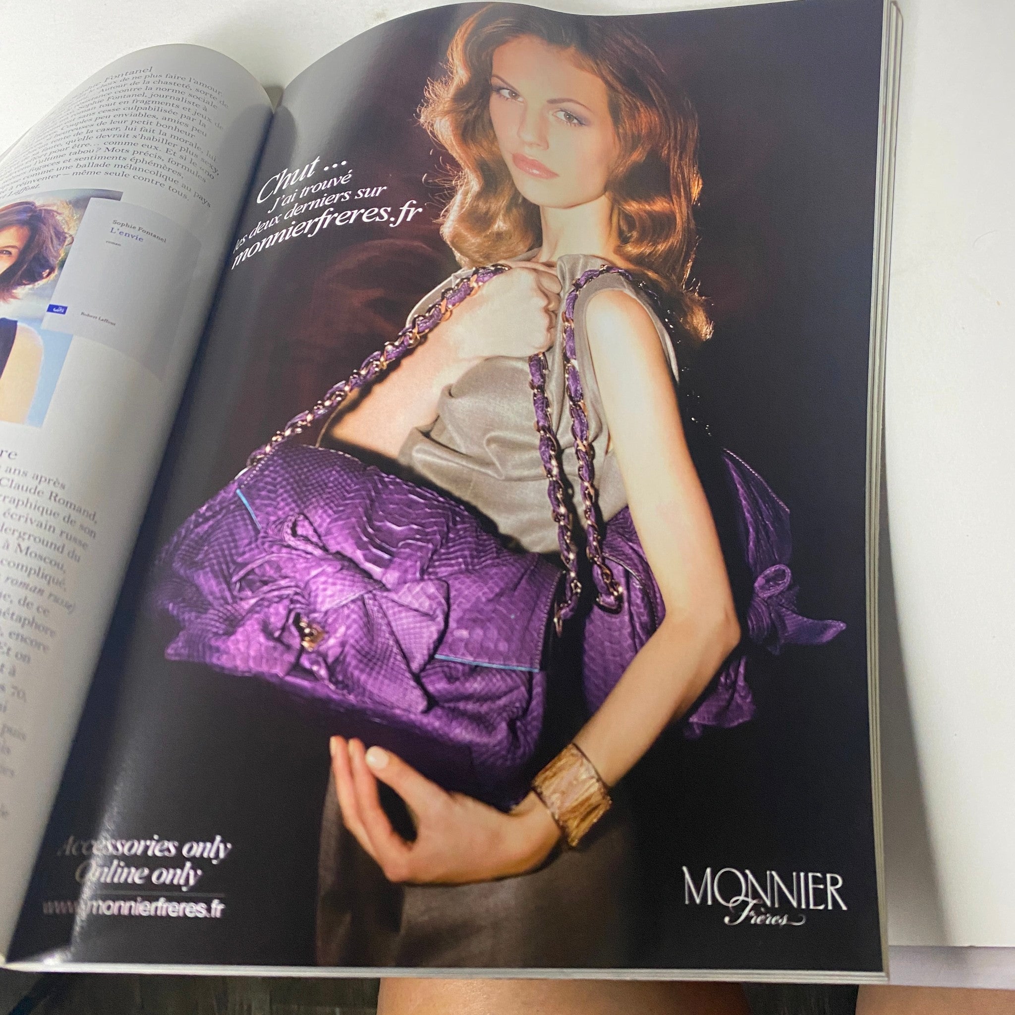 Vogue Paris Magazine September 2011 No. 920 showcasing a model holding purple bags from Monnier Frères. The magazine features a stylish article on accessories with a focus on fashion design.